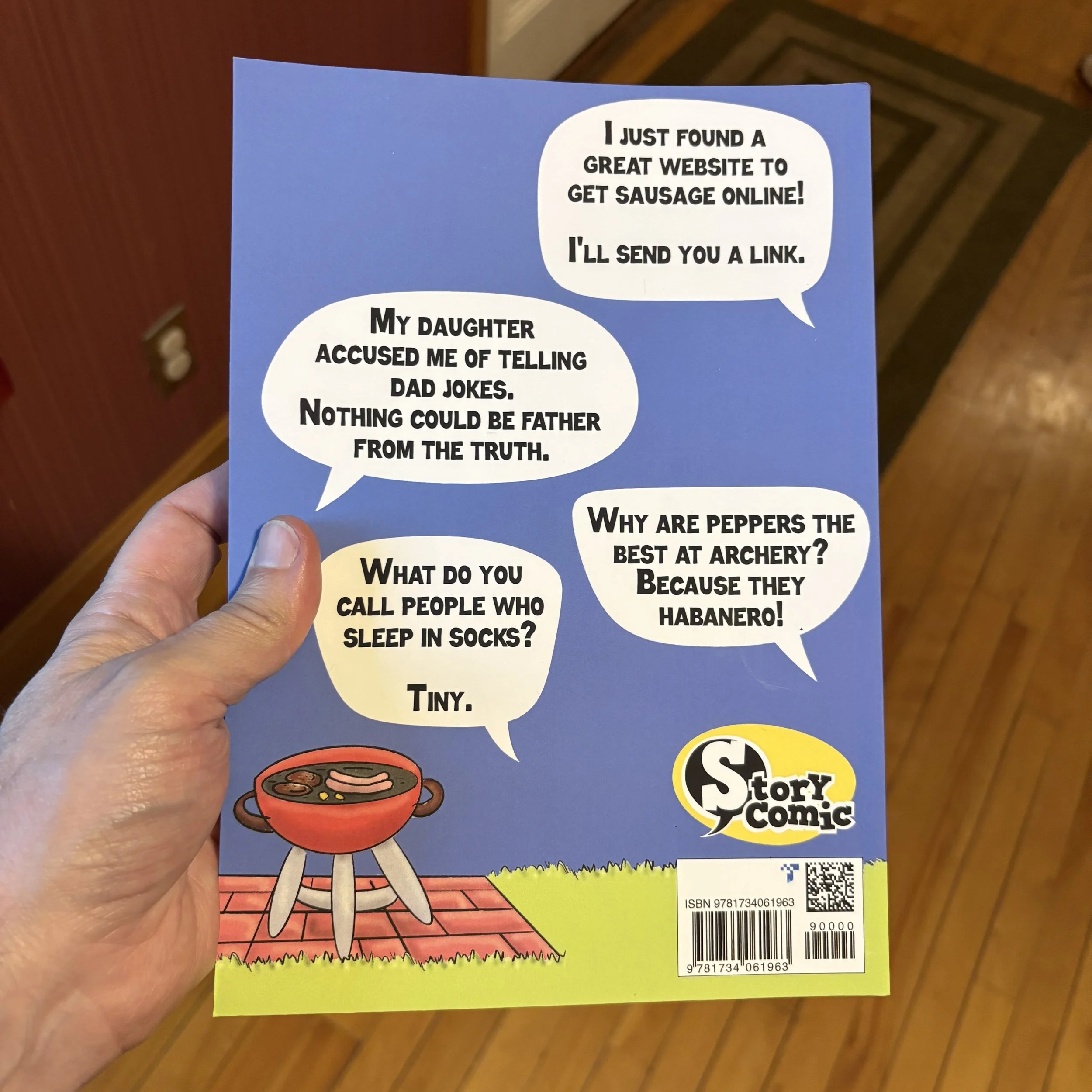 Daddest Jokes holding  back cover.jpeg