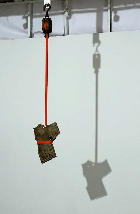 suspension #1. altered found objects, nylon band. 2008. approx. 5' in length.