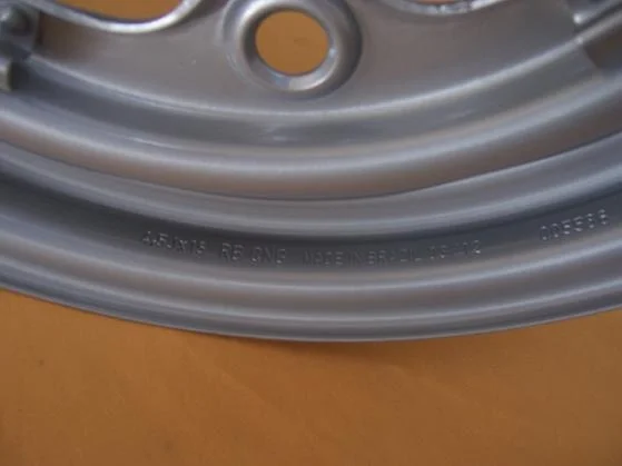 PICTURE OF THE STAMPED MARK ON THE WHEEL - FRONT SIDE RIM.JPG
