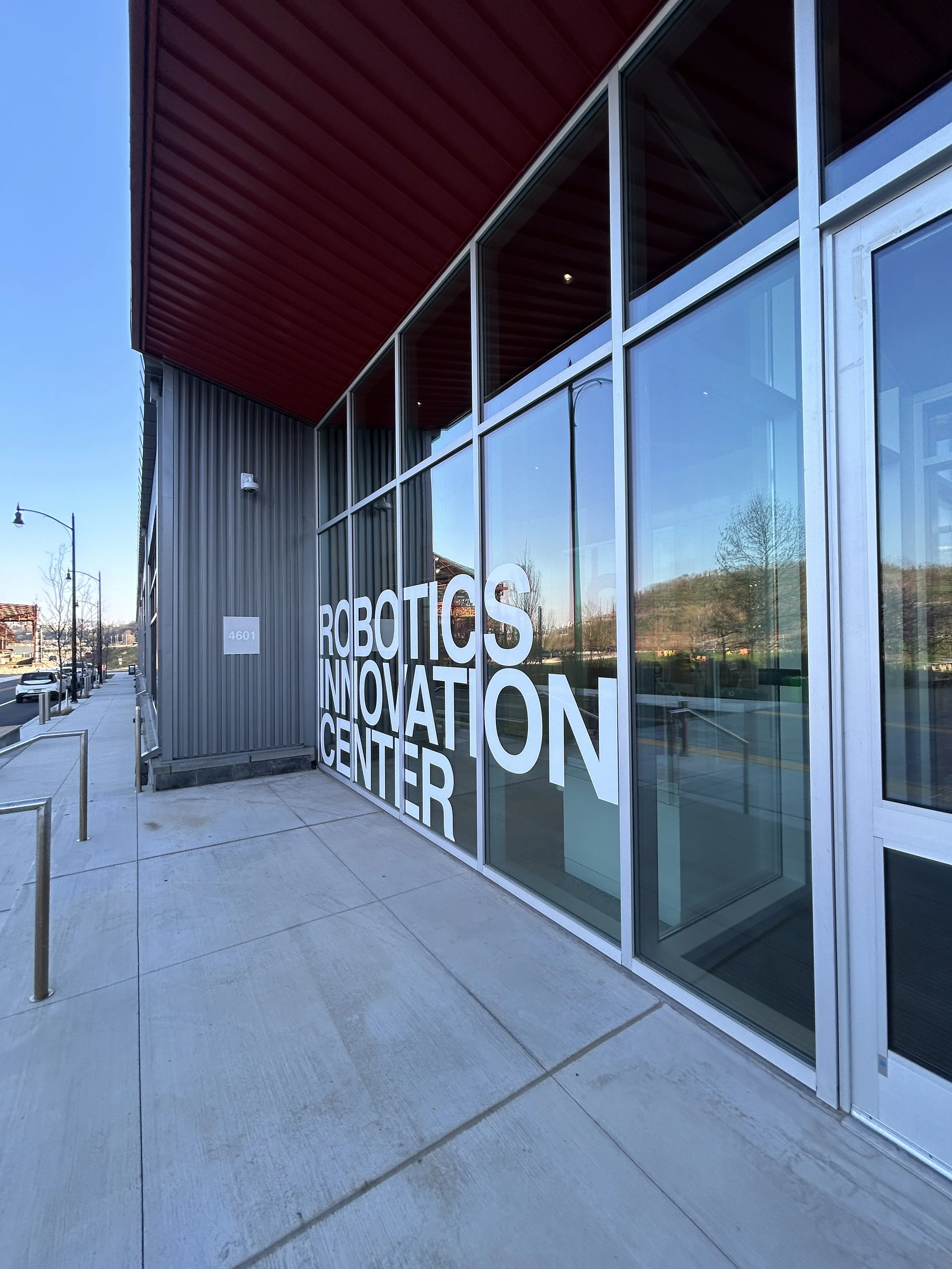 a photo of the front glass doors of the Robotics Innovation Center
