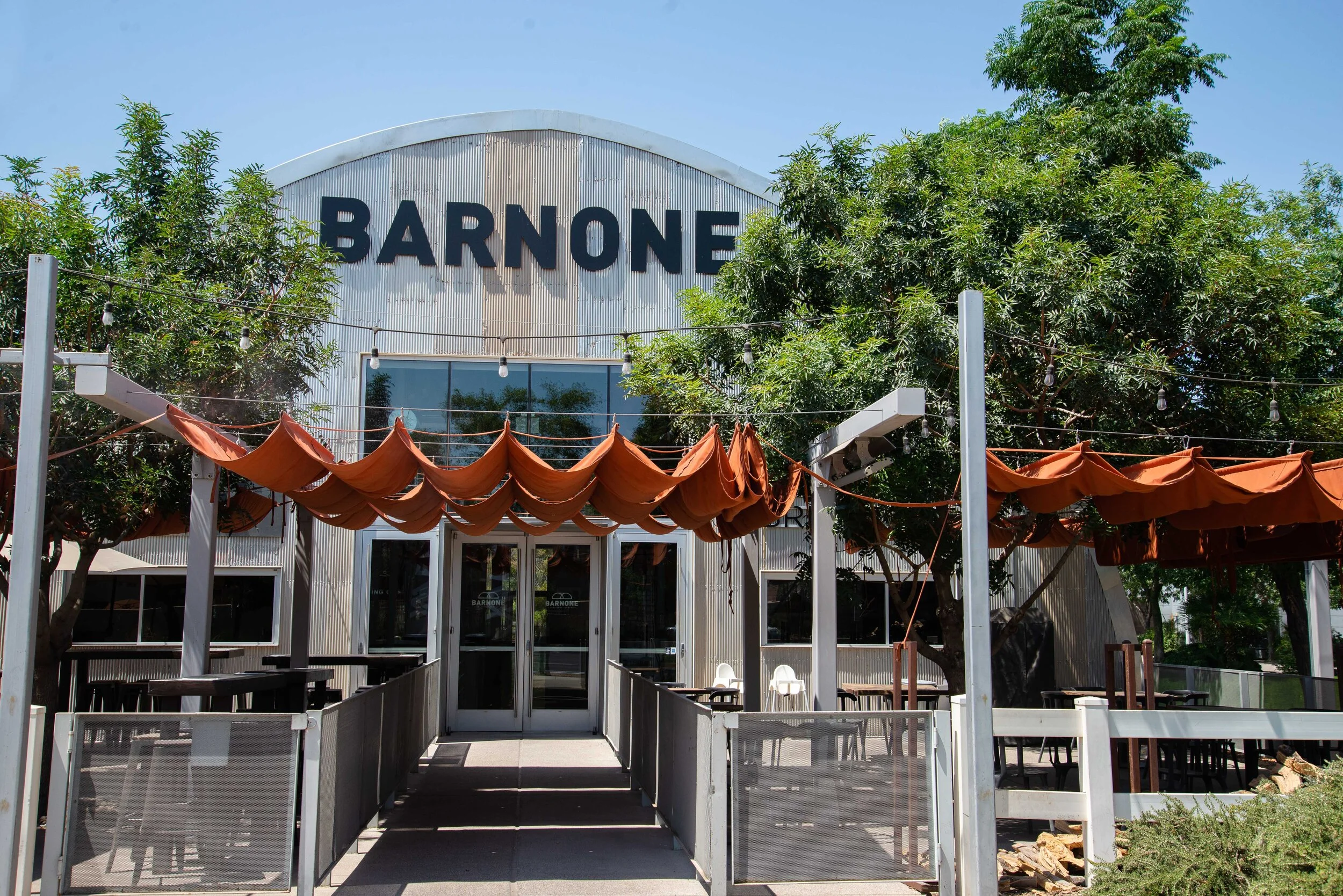 outdoor covered patio inf ront of barnone