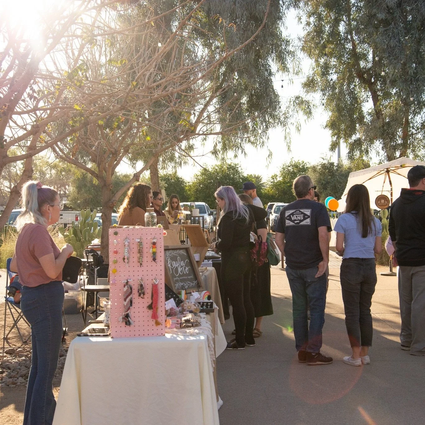 local vendor at their booth. customers walking around