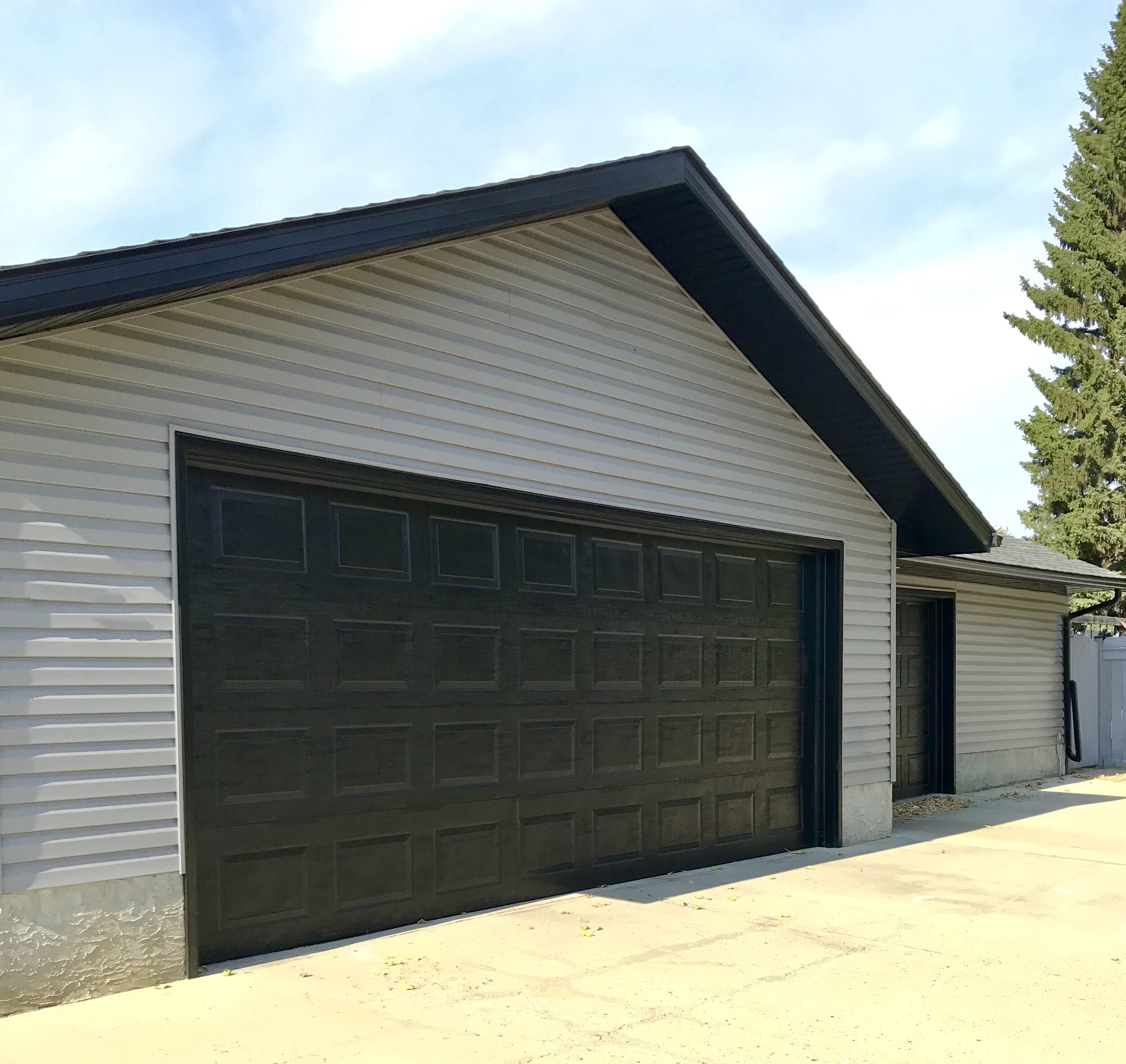 Exterior-Renovation-Garage Door-Grey Siding-Style Maven Decor Interior Design-Edmonton Canada