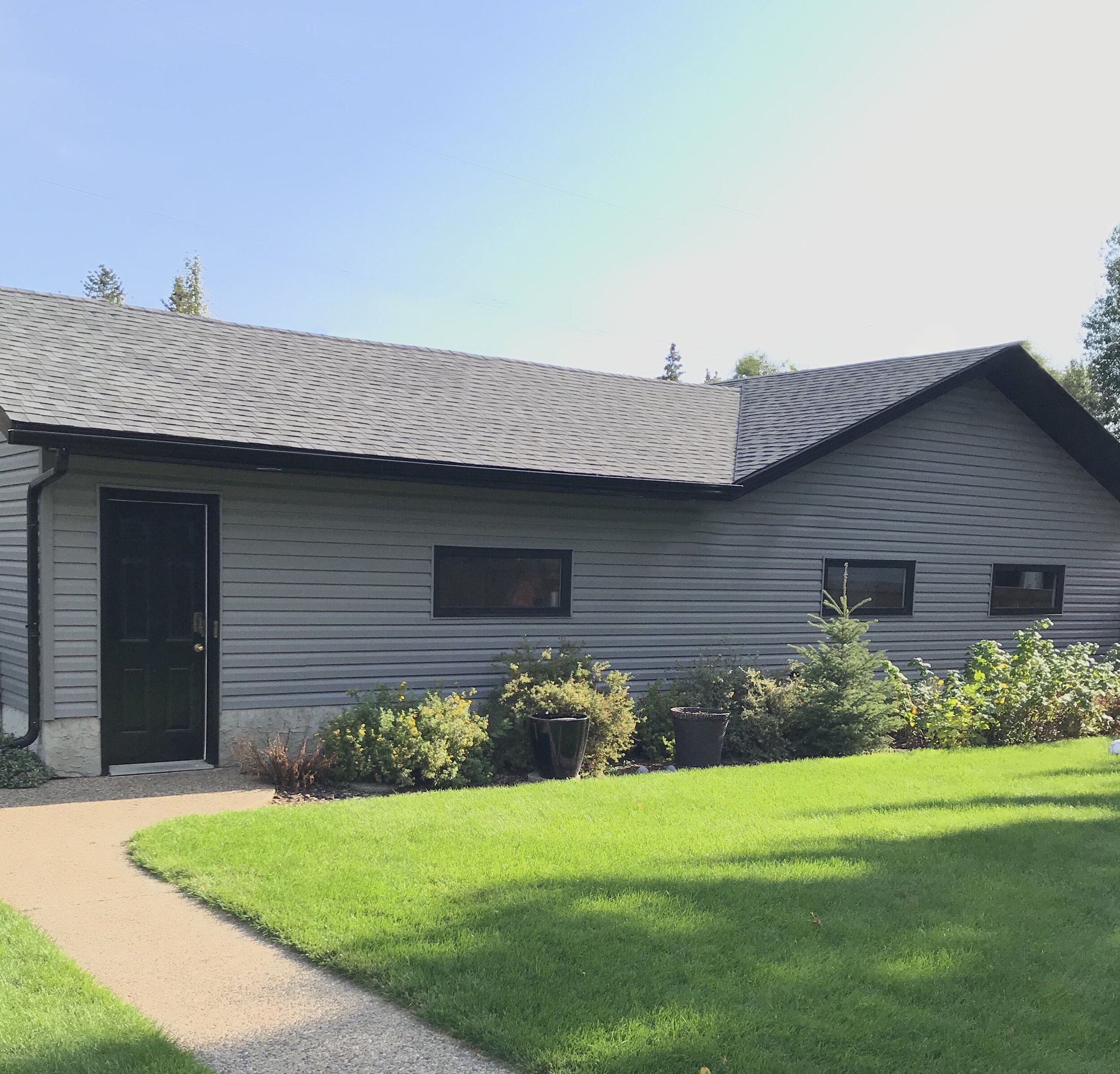 Exterior-Renovation-Garage-Black Door-Black Windows-Grey Siding-Style Maven Decor Interior Design-Edmonton Canada