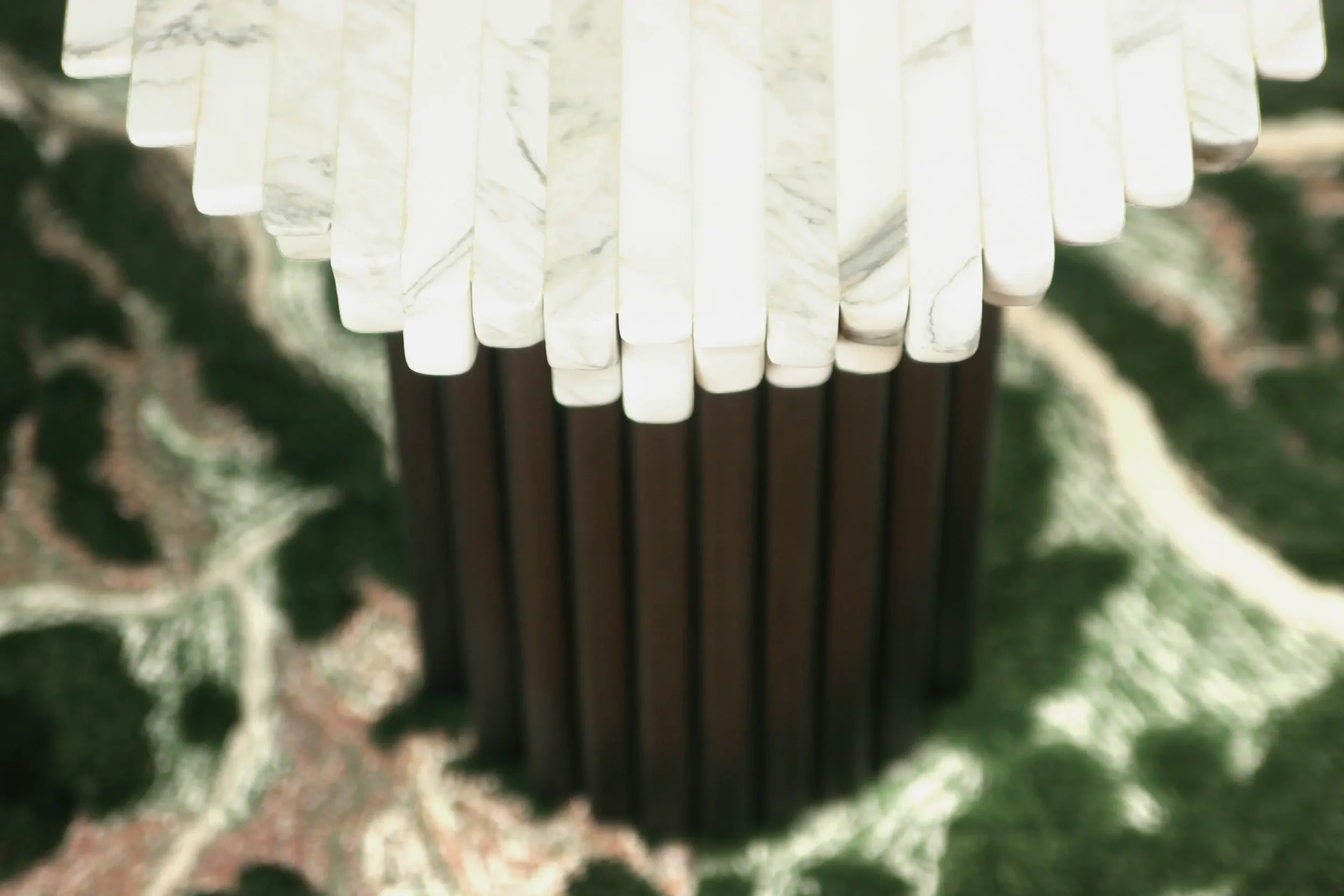 krzywda-EG-01-edge-side-table--top-and-base-tangible-archives-epoch-pinton-rug.webp