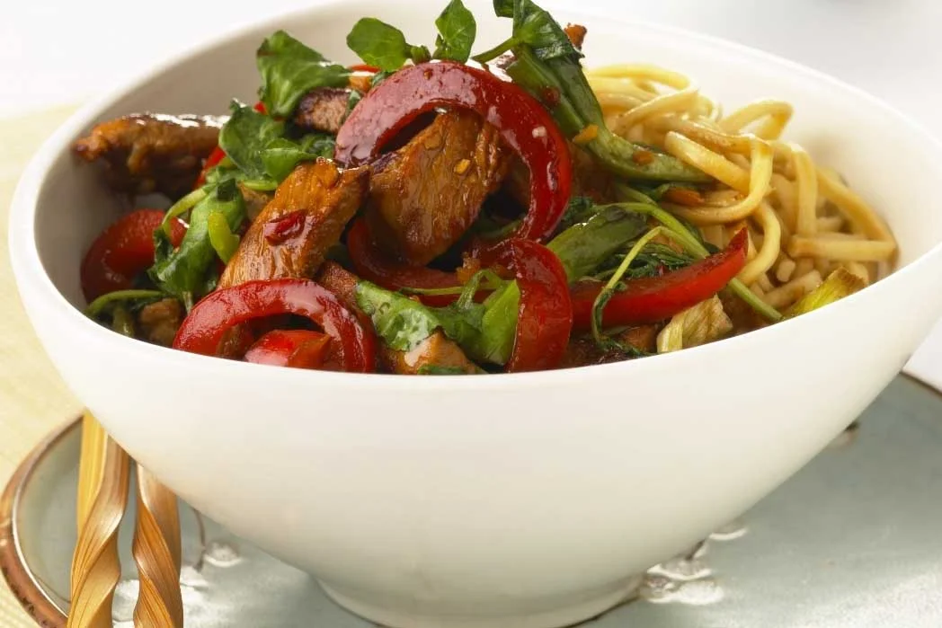 Sweet pork and chilli stir fry with watercress