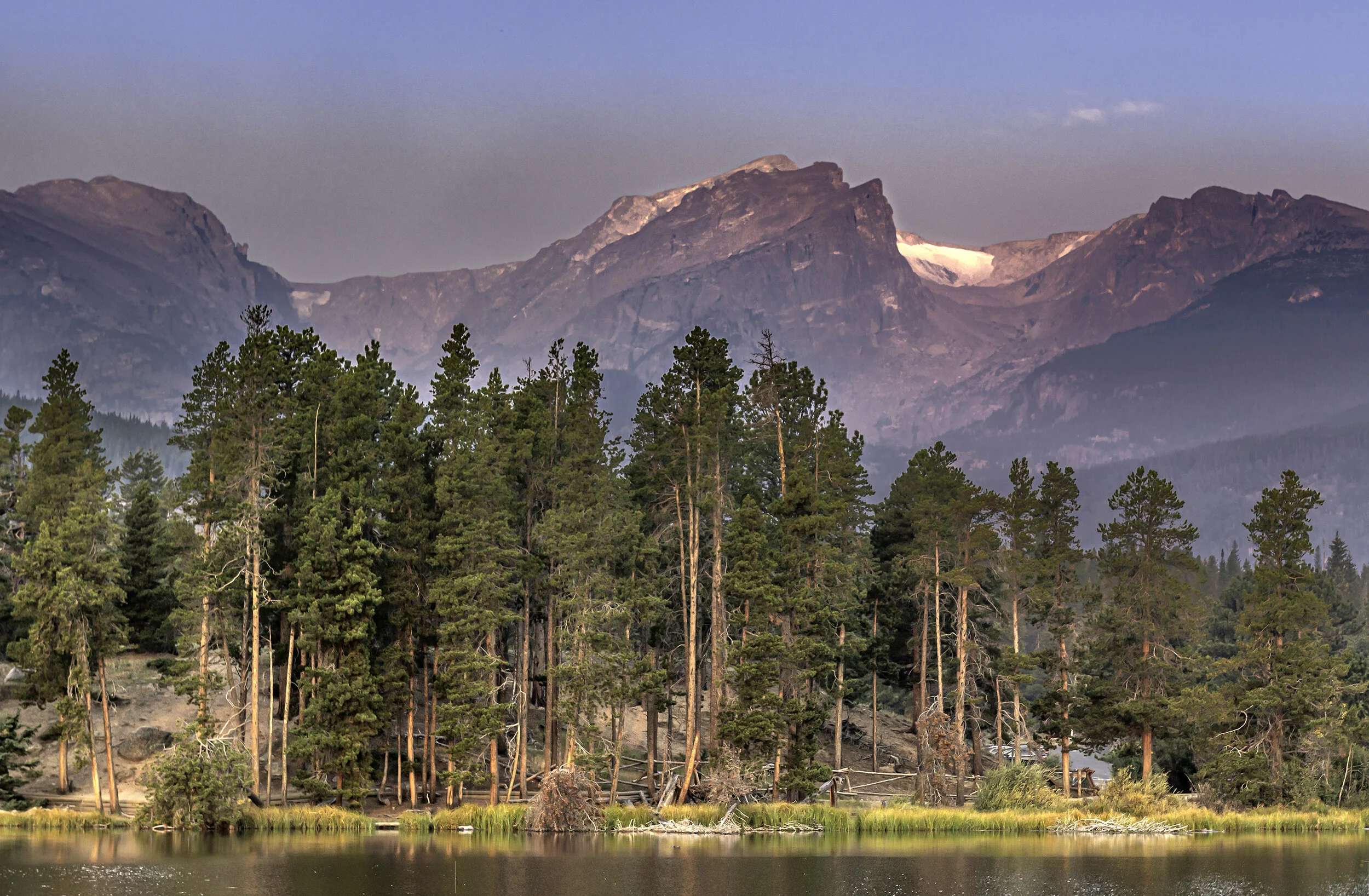 Early morning at Sprague Lake. Due to the wildfires i California, a constant haze of smoke obstructed a clear view of the distant mountains.