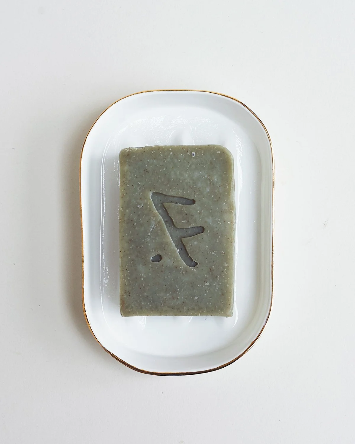 Feldspar, cold-press ‘kelp’ soap bar in gold soap dish