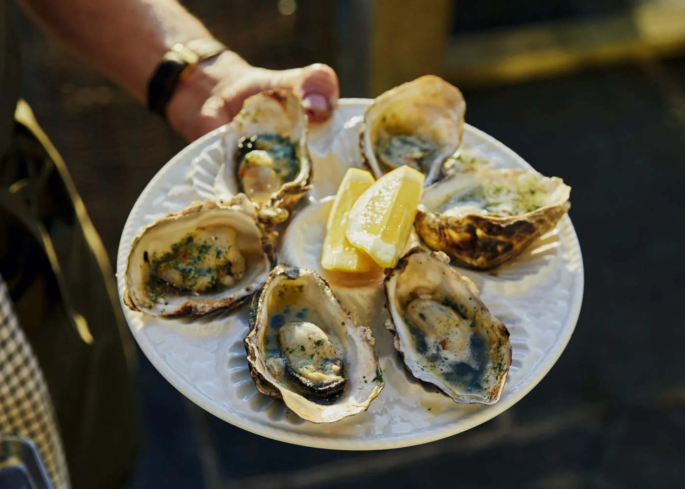 Serving up fresh local oysters. Louise & Tim’s supper club at Treverra Farm, Cornwall. Photo by Emli Bendixen.