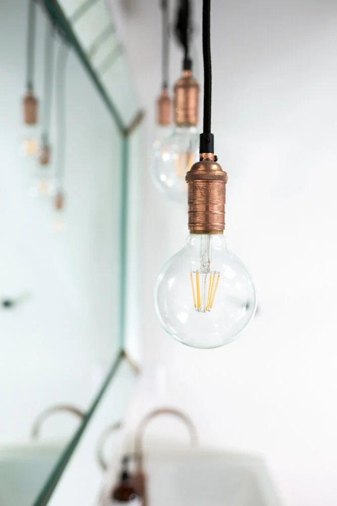 26.hanginglights.masterbathroom.vintagemirror.grandrapids.michigan.interiordesigner.jpg