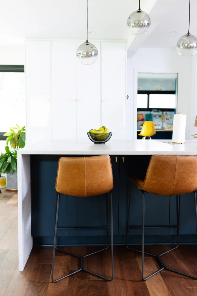 62.kitchenisland.waterfallcountertop.leatherstools.grandrapidsinteriordesign..jpg