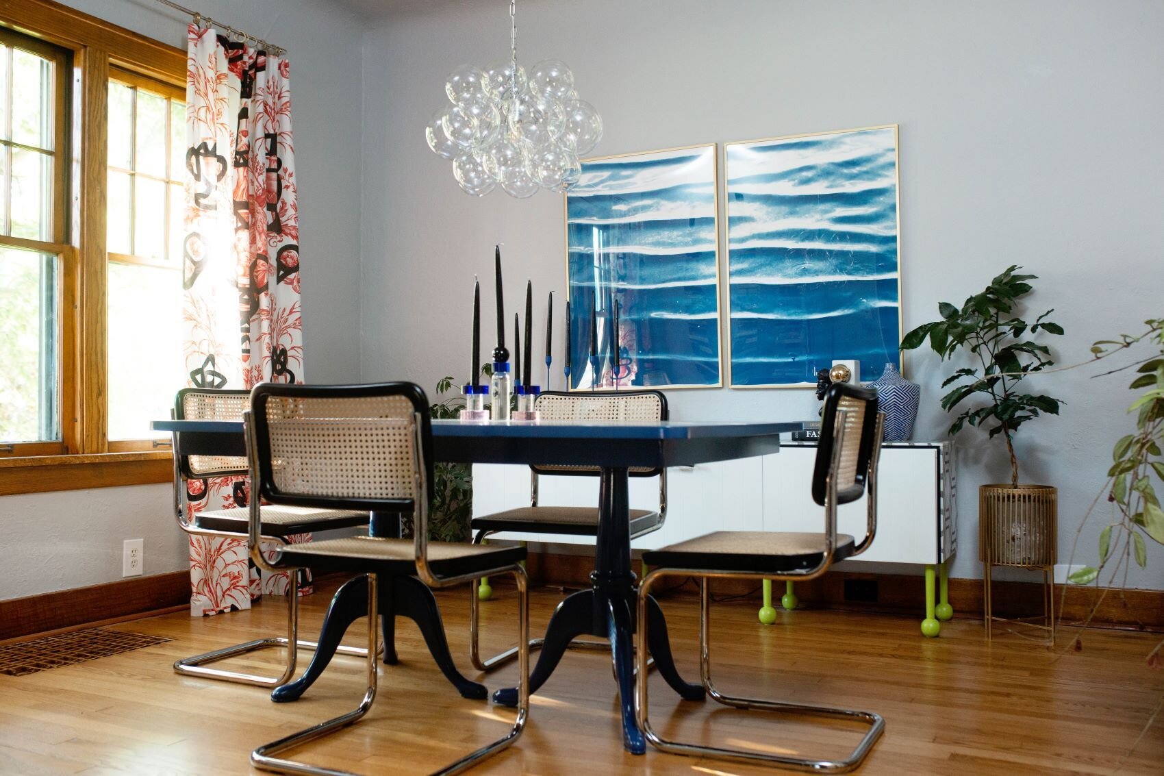 30  Blue  laquer table with black cesca chairs bubble chandelier blue modern art red pierre frey curtains.jpg