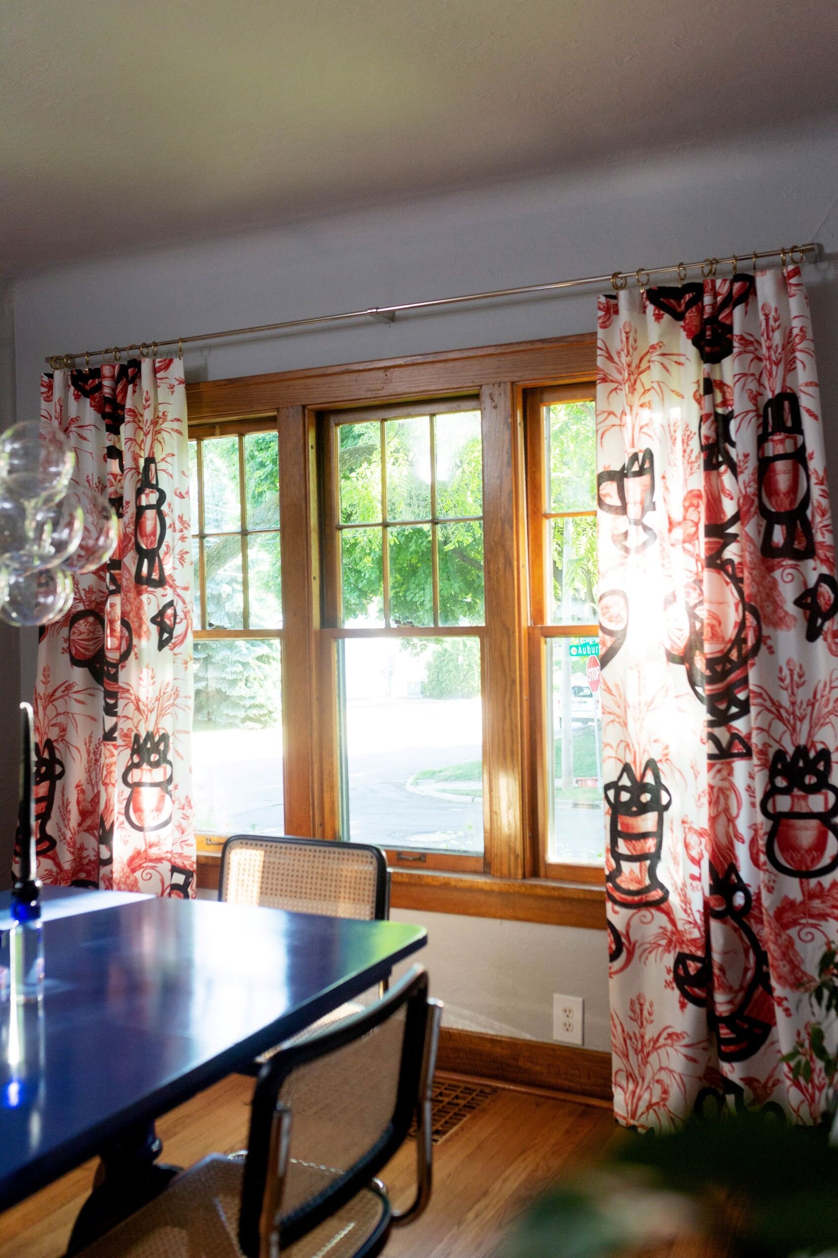 32  Blue  laquer table with black cesca chairs bubble chandelier blue modern art red pierre frey curtains.jpg