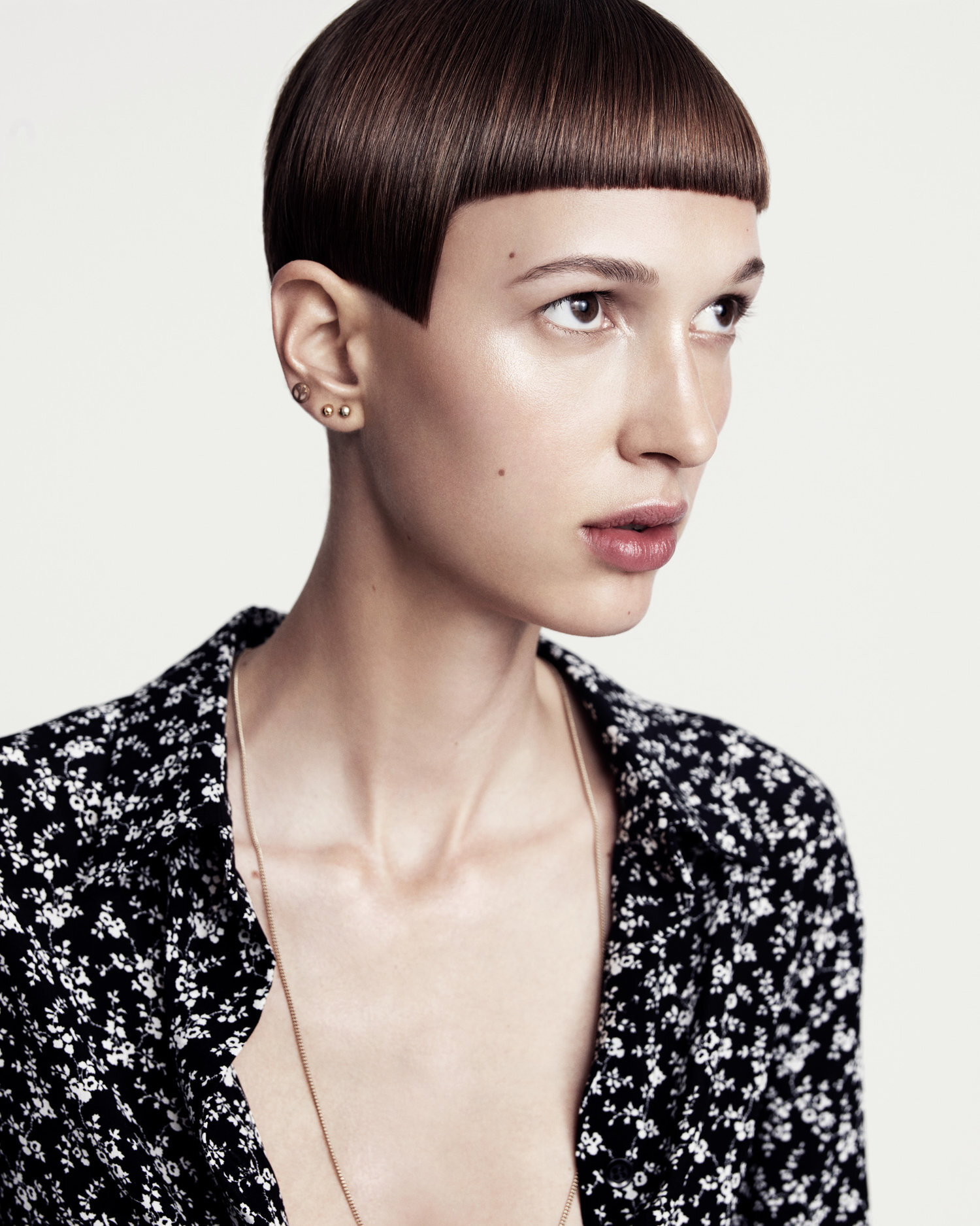 Female model with short structured brunette hair styled by Tom Connell
