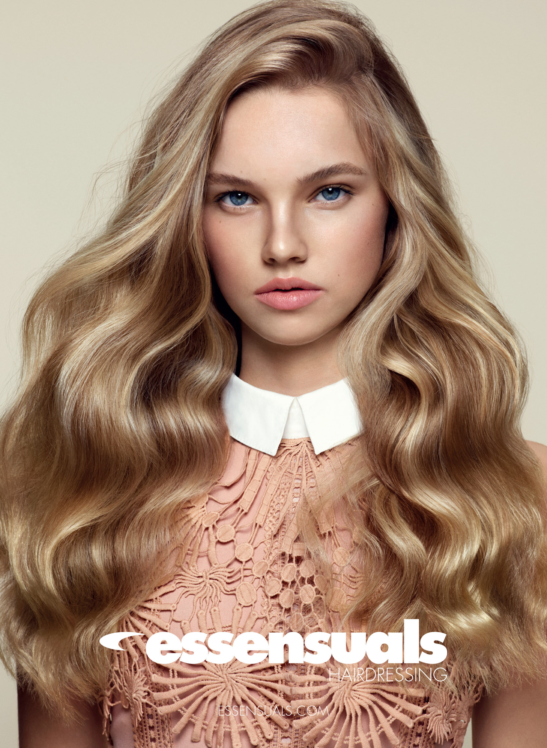 Female model with shiny long blonde hair for Essensuals hair campaign
