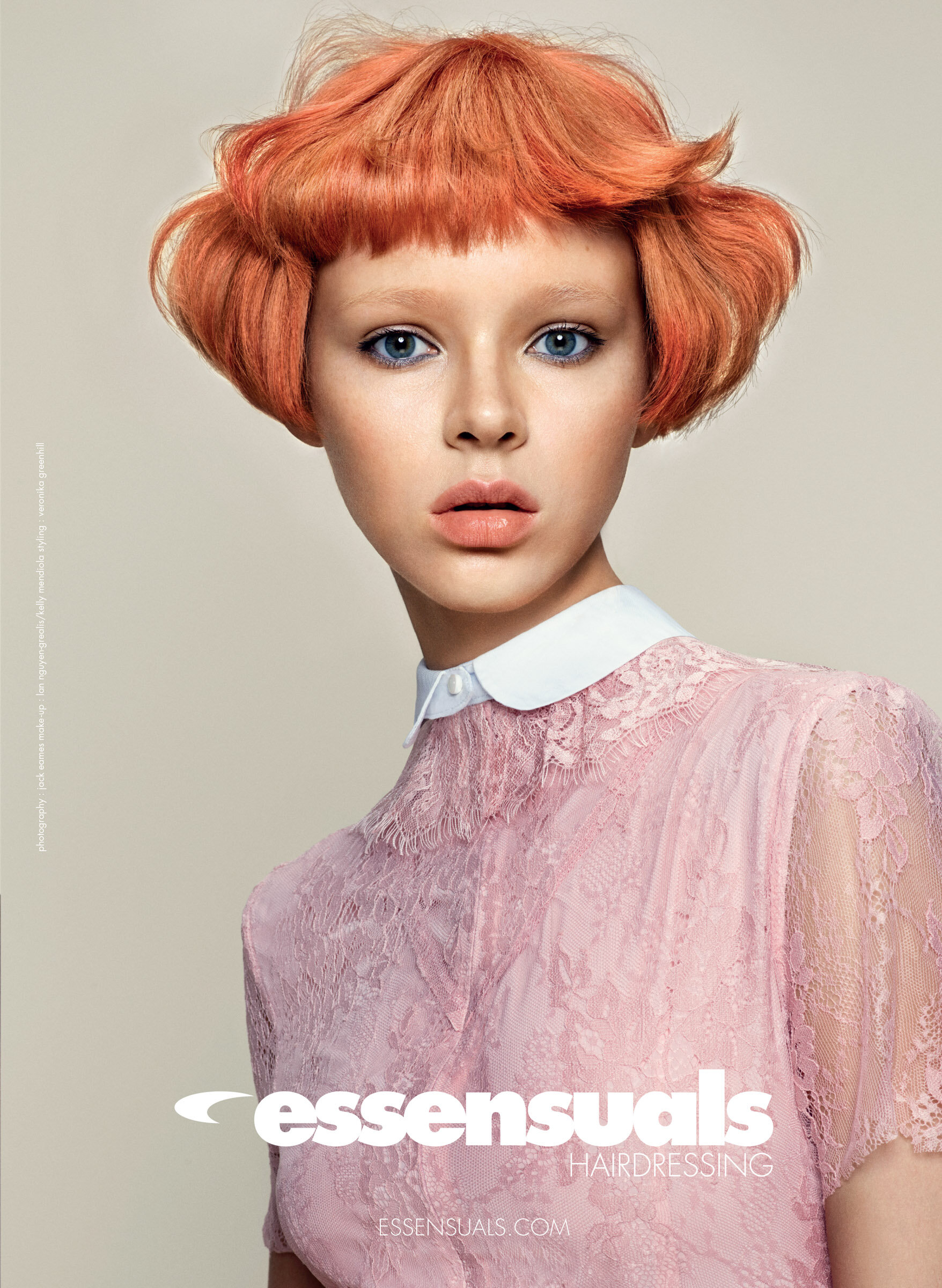 Female model with short orange coloured hair styled by Toni and Guy's Essensuals