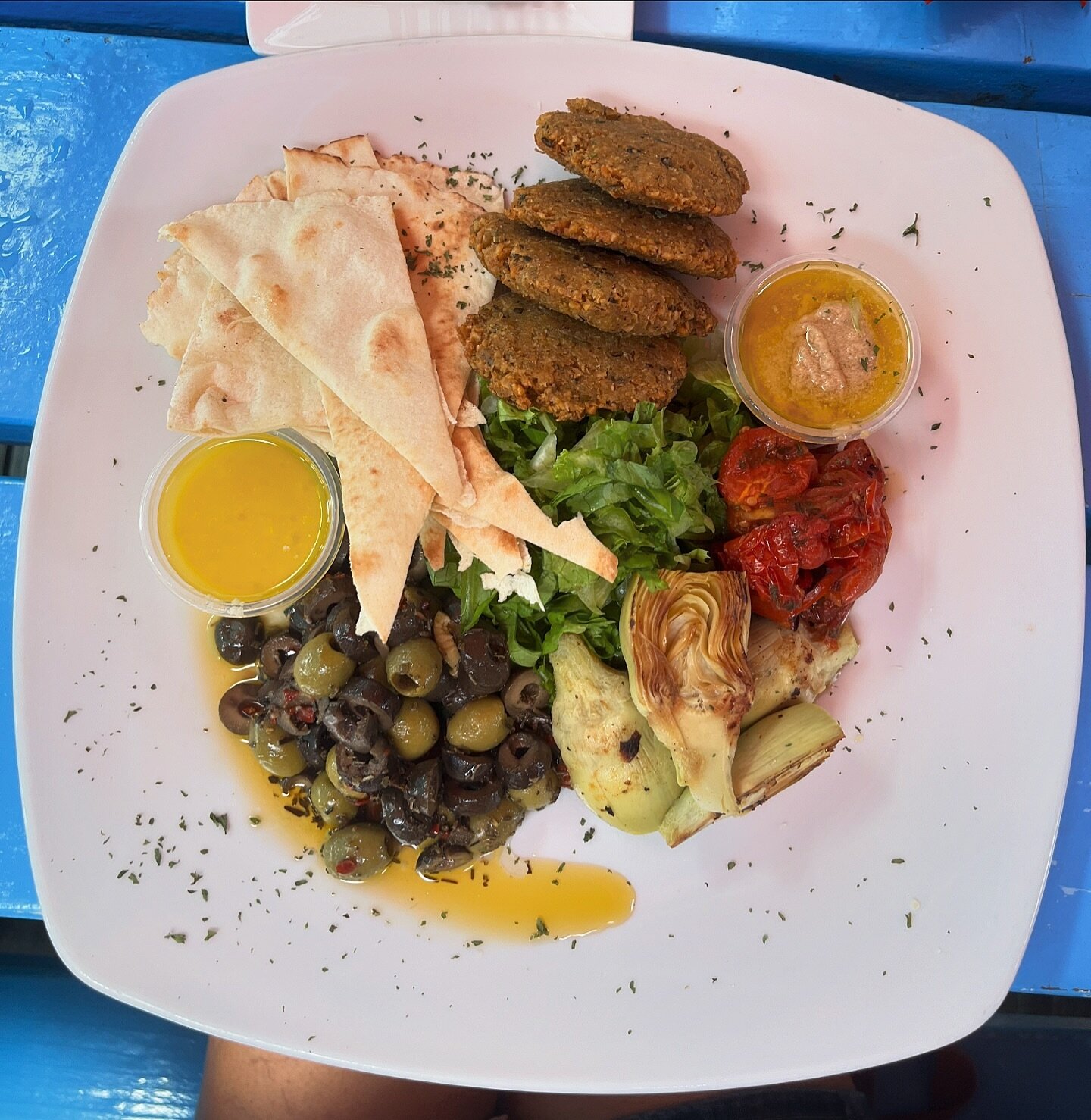 Our new Mezze Platter 🫒

A delectable vegetarian option including: Falafels, grilled artichokes, pita bread, hummus, olives &amp; salad and a tasty dressing on the side.