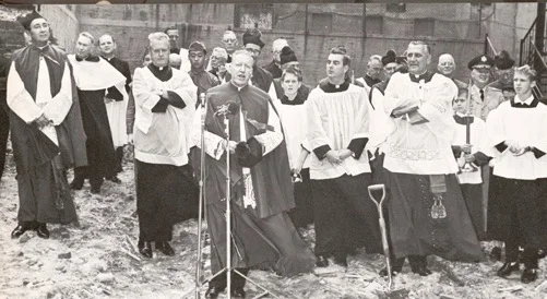 Msgr Farriker blesses site of new church, which was completed in 1966, three years after the fire.