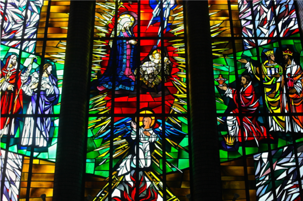The Epiphany Window of the Madonna and Child that survived the fire. It is installed in the Narthex of the current church.