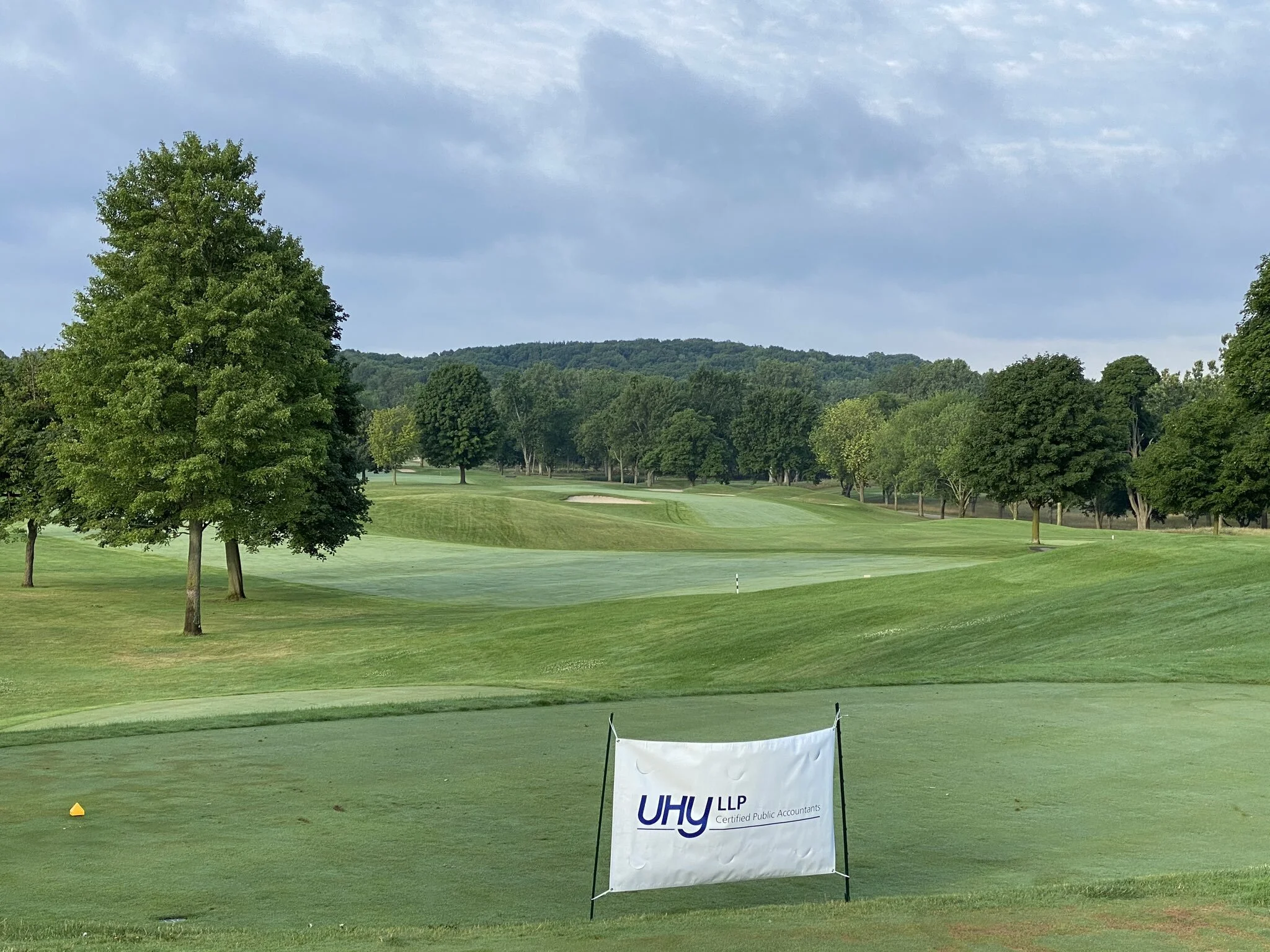 KATKE Clubhouse with UHY banner.JPG