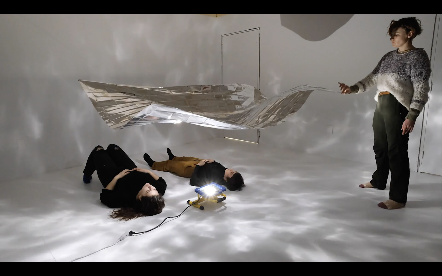 Drawing with a mylar emergency blanket hung from 4 elastic strings