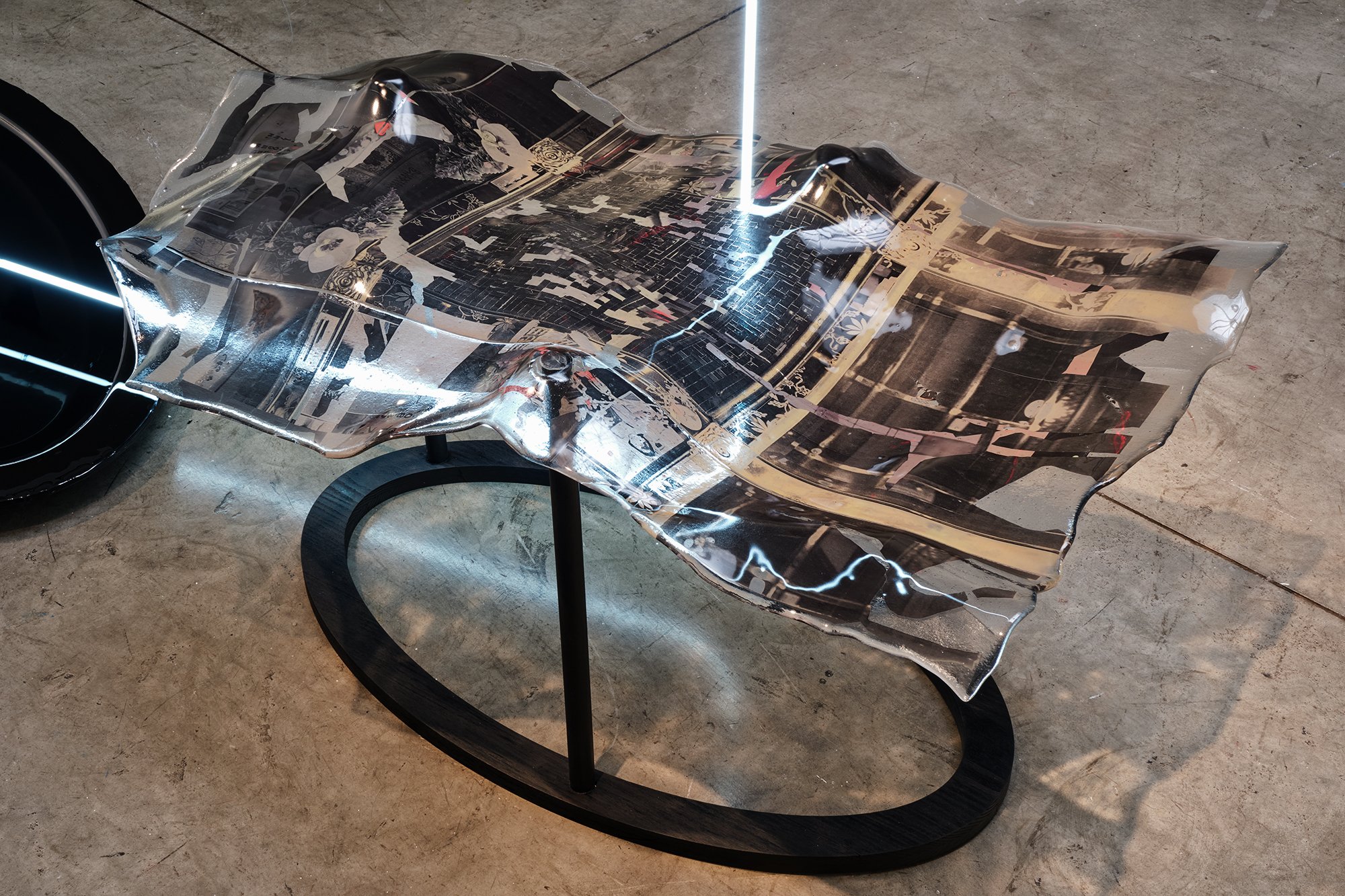  Detail view of the slumped glass with woven photographs  
