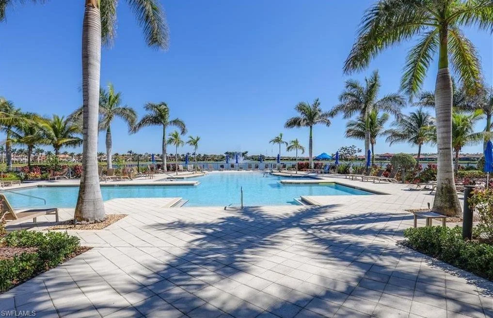 Artesia Naples Community Pool with Grand Lake in Background.jpeg