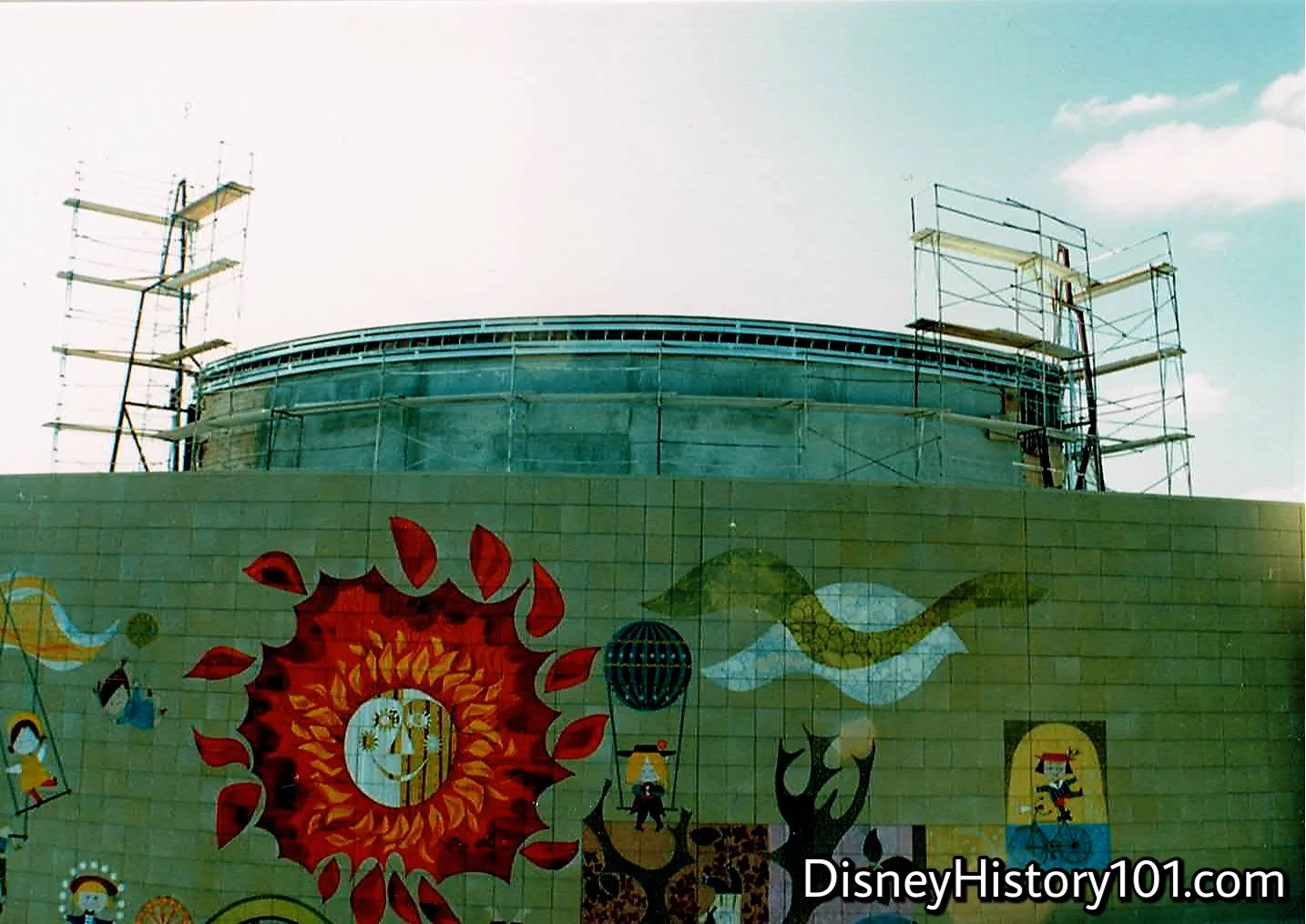  The southern  “The Spirit of Creative Energies Among Children”  mural encompassed the façade of the former  Adventure Through Inner Space  building.  In this photograph, an extension has been made to top the structure, before exterior work is carrie