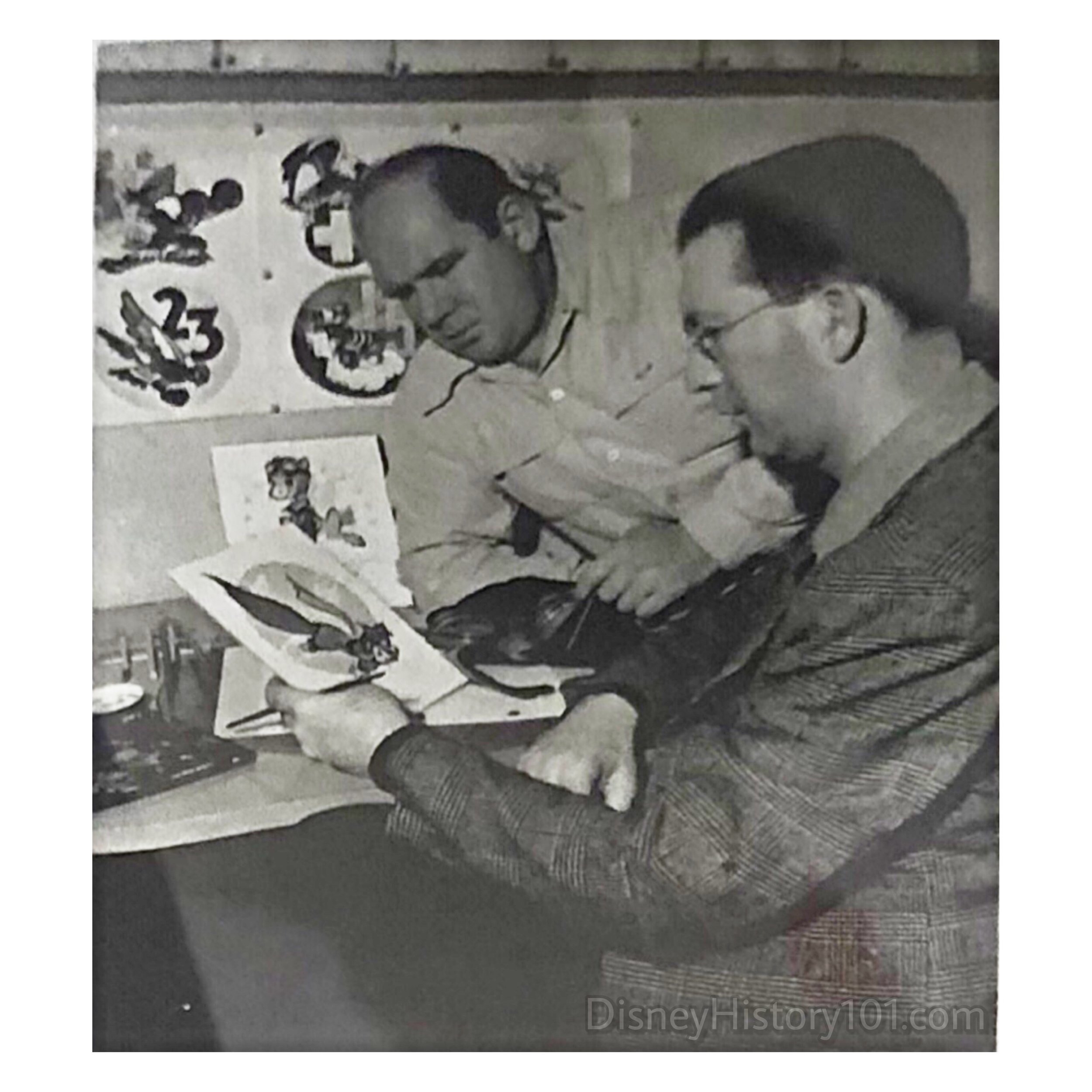 Roy Williams (left) and Hank Porter (right) create insignias for the Walt Disney Studios Insignia Department.