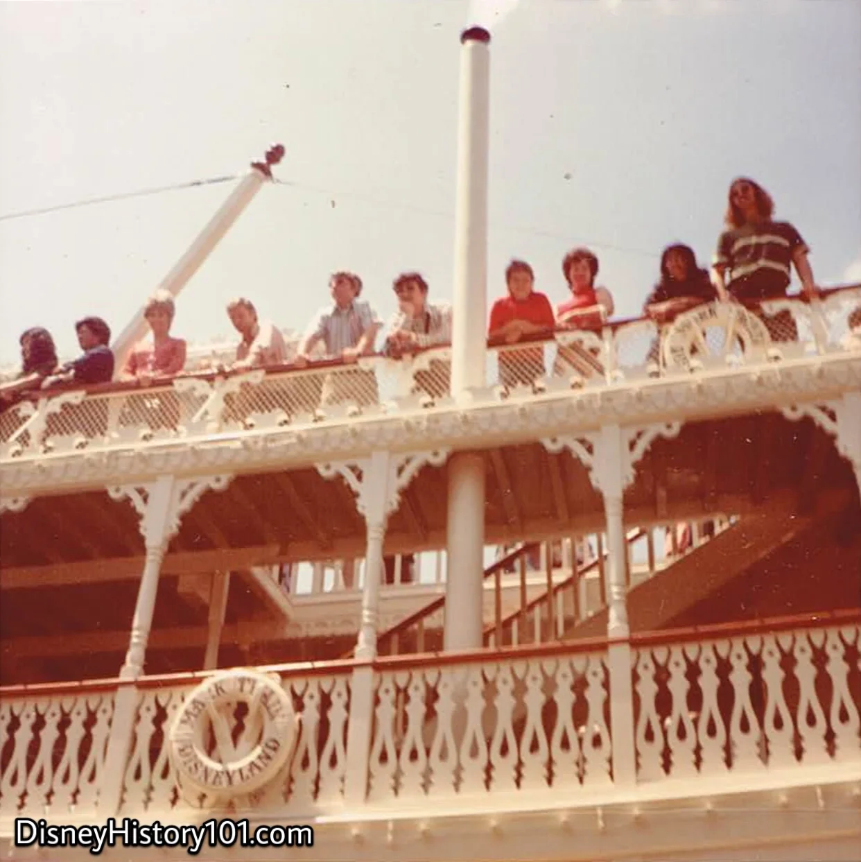 Guests stand on the Mark Twain Texas Deck House as viewed from the Mark Twain Steamboat Dock