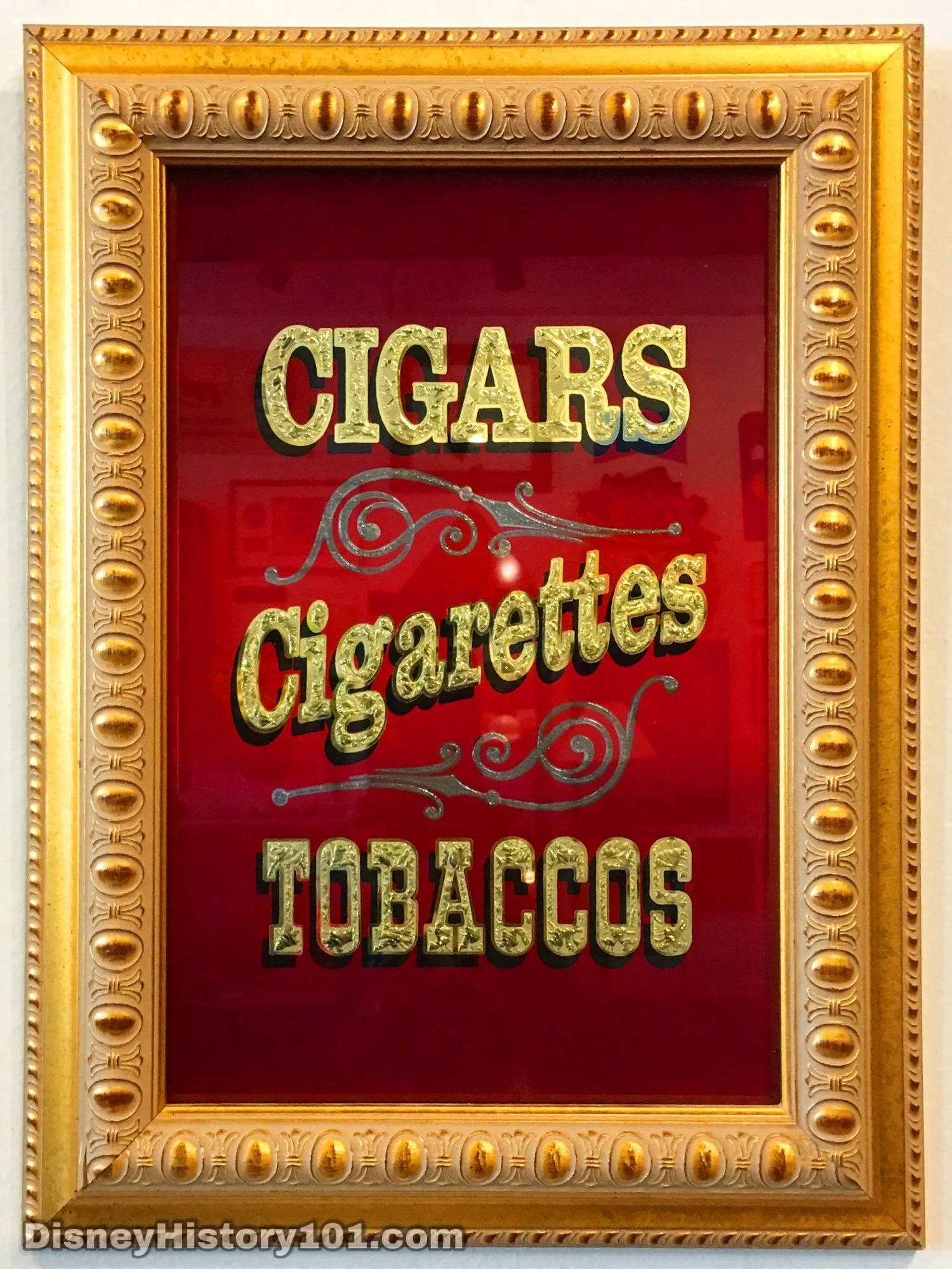 MAIN STREET TOBACCONIST SHOP MIRROR SIGN with GOLD LEAF LETTERS, (c. 1960s); When signage is looking pretty worn and stressed it is replaced or rehabilitated.