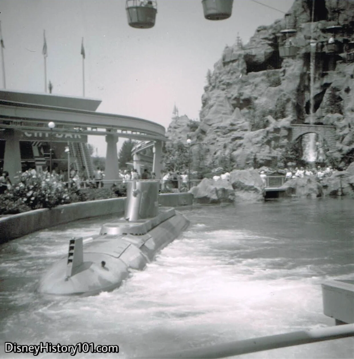   “All ahead one-third!”  A “dense curtain of small bubbles rush toward the surface of the water” and the hull, as the boats begin to “dive.” Submarines head into the  Front Lagoon , and yet the conning towers never submerge. Below the water, passeng