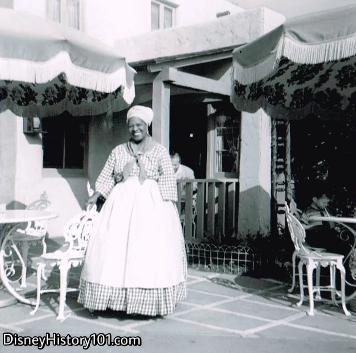 Aunt Jemima (starring role portrayed by Palmere Jackson) makes Disney magic and displays Disney Courtesy with a friendly smile, c. 1957