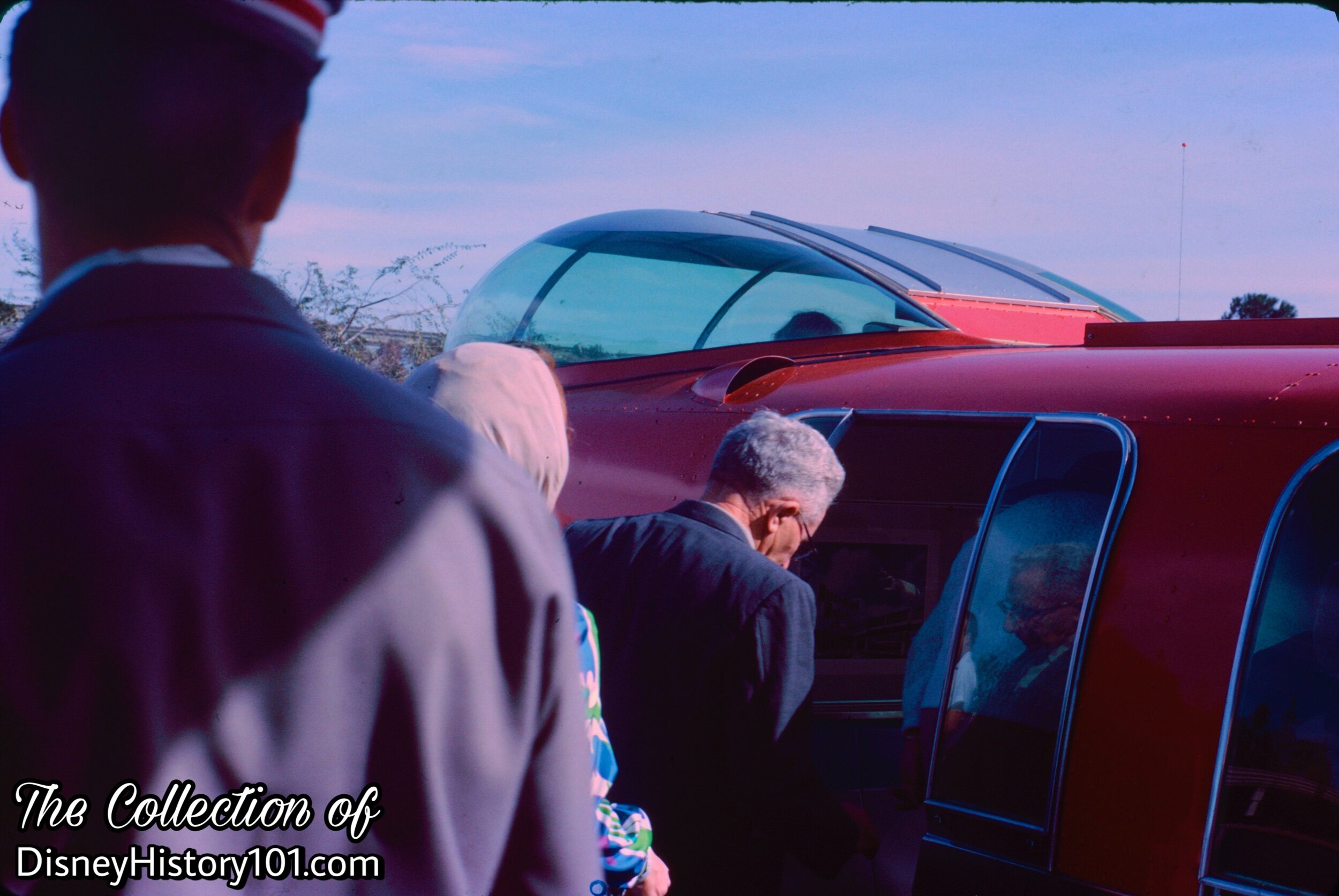 Guests entering the nose cone of the Monorail Mark II Red