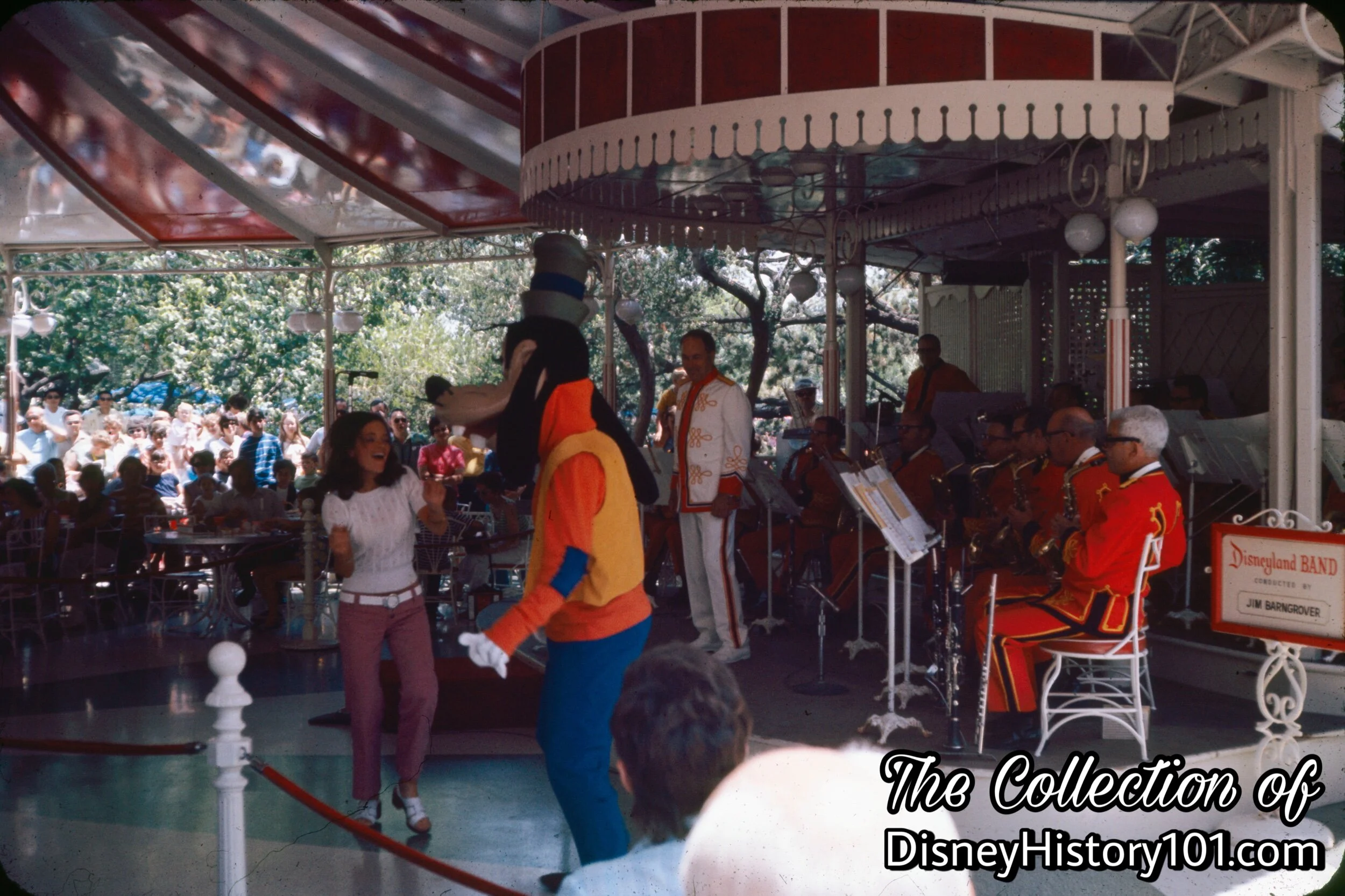 Pictured (Above) : Goofy and a guest “get into the swing” of things during a set performed by the Disneyland Band at Carnation Plaza Gardens, (July, 1972)