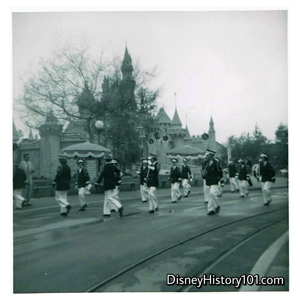 A visiting band marches toward the “Disneyland Christmas Bowl”, (1955)