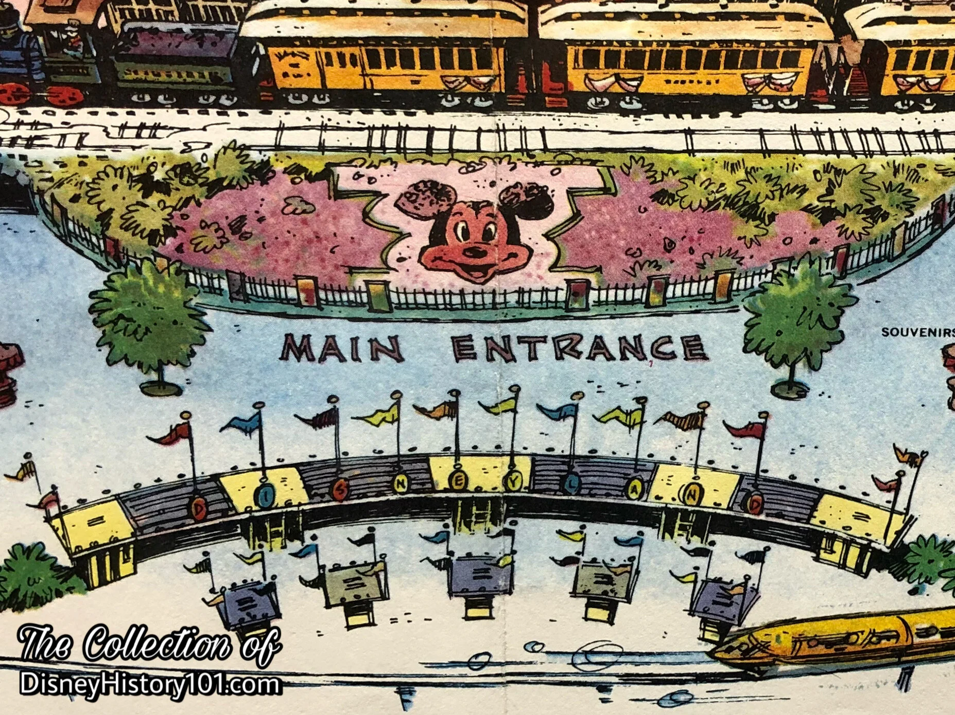 Beyond the Ticket Booths and Turnstile Structures are the Main Entrance and Mickey Mouse Floral Portrait in the “Outer Lobby.”