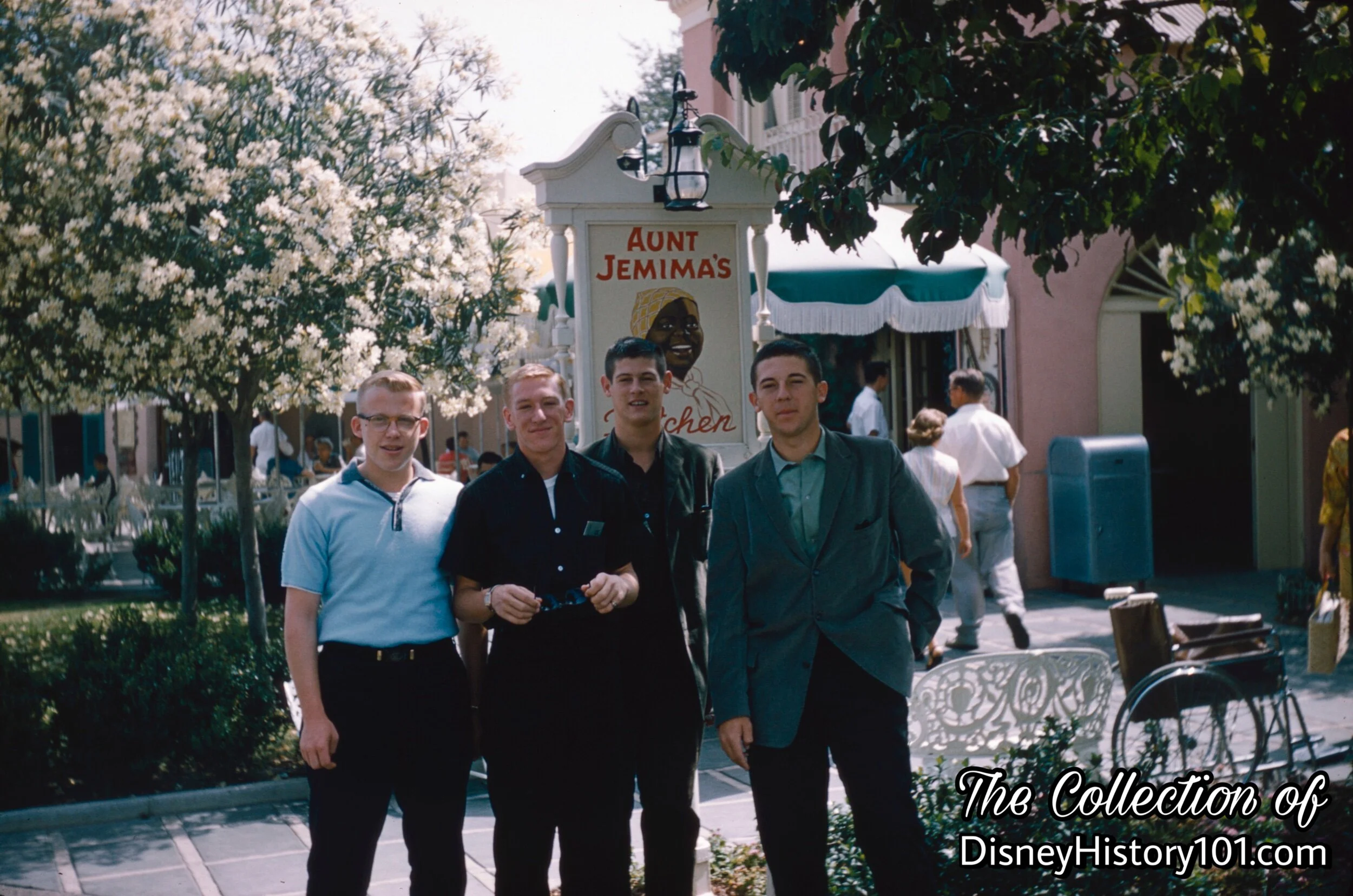 Guests commemorate their visit with a photo next to the Aunt Jemima’s Kitchen Sign.