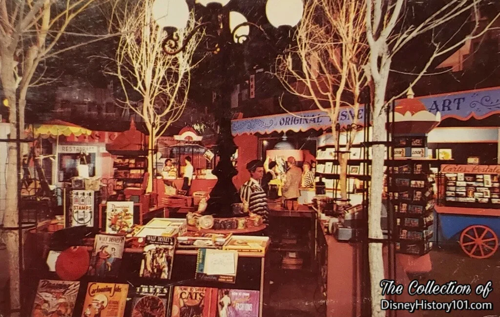 A Tomorrowland Art Corner Souvenir Postcard preserves its "Streets of Paris" theme (or, character).
