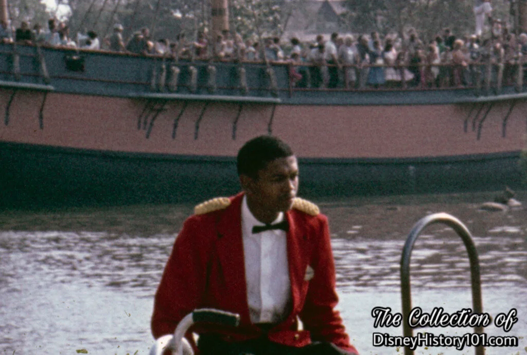 Disneyland Promenade Deck Bar Employee waits near the Mark Twain Steamboat Dock
