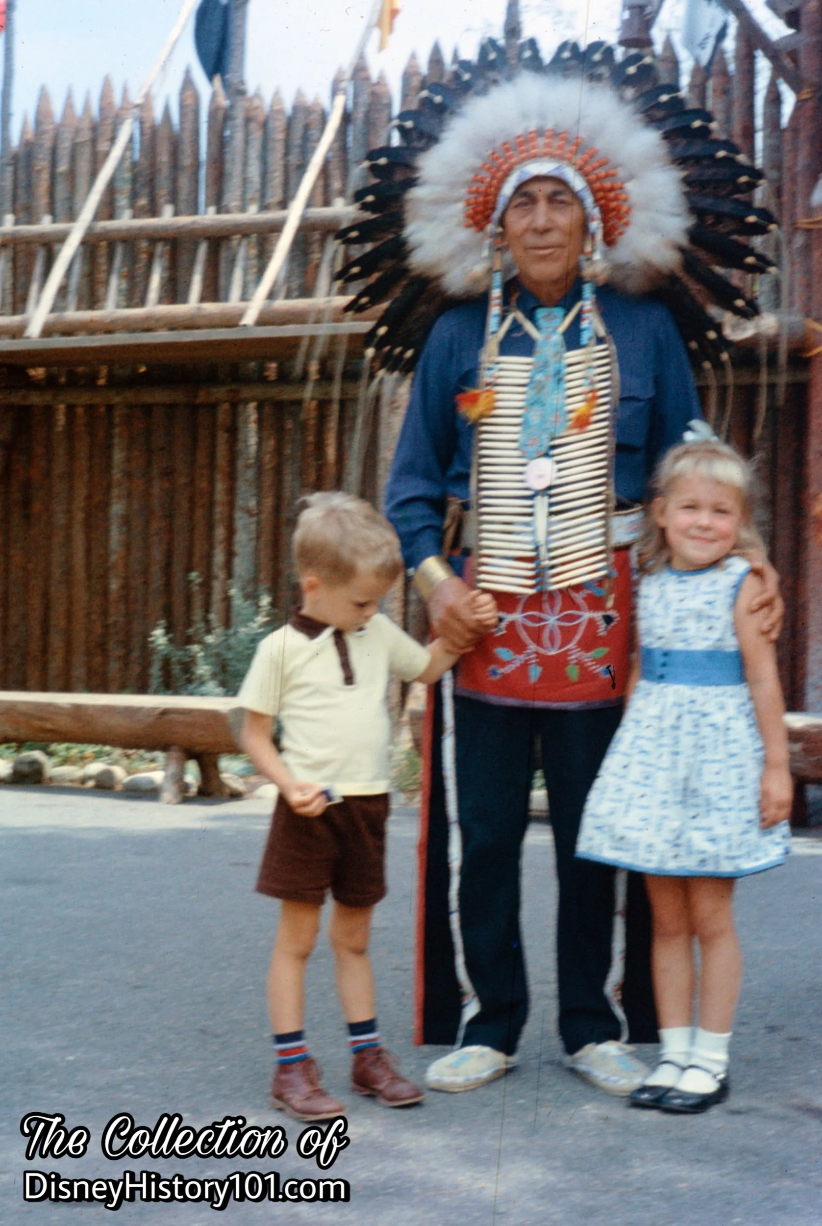 Louis Heminger (CHIEF SHOOTING STAR) displays Disney Courtesy with a smile and little gestures towards guests, c.1960s.