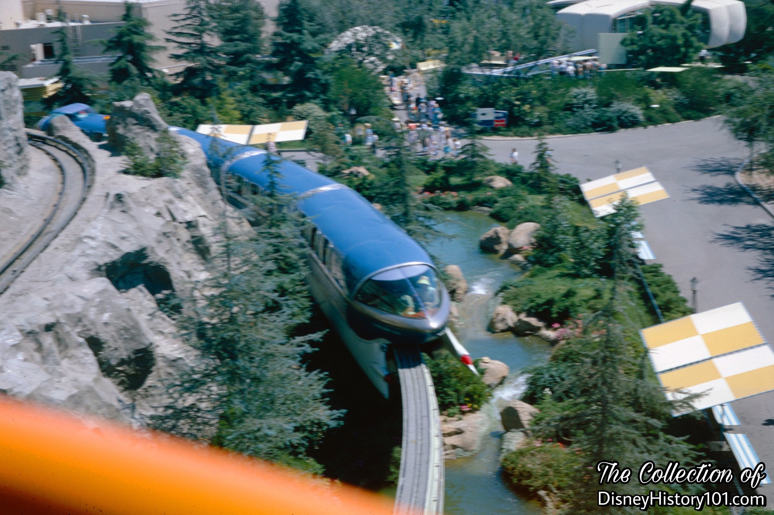 REENTERING THE PARK AND TOMORROWLAND SEGMENT - The Monorail Mark II Blue passes one of the lowest points of the Beamway.