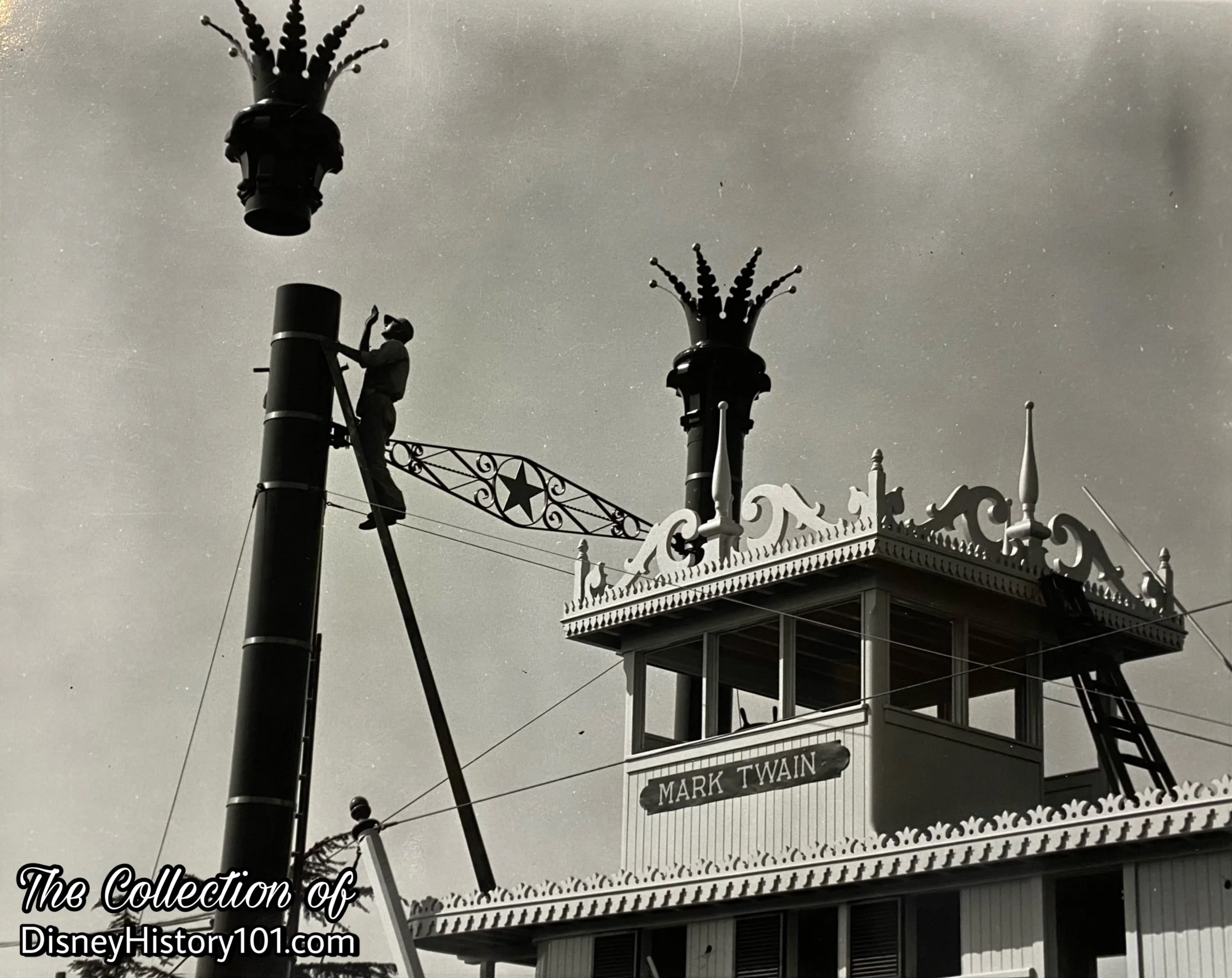 The Mark Twain Smokestacks are placed on their Chimneys in a press release photograph; ©️Walt Disney Productions.