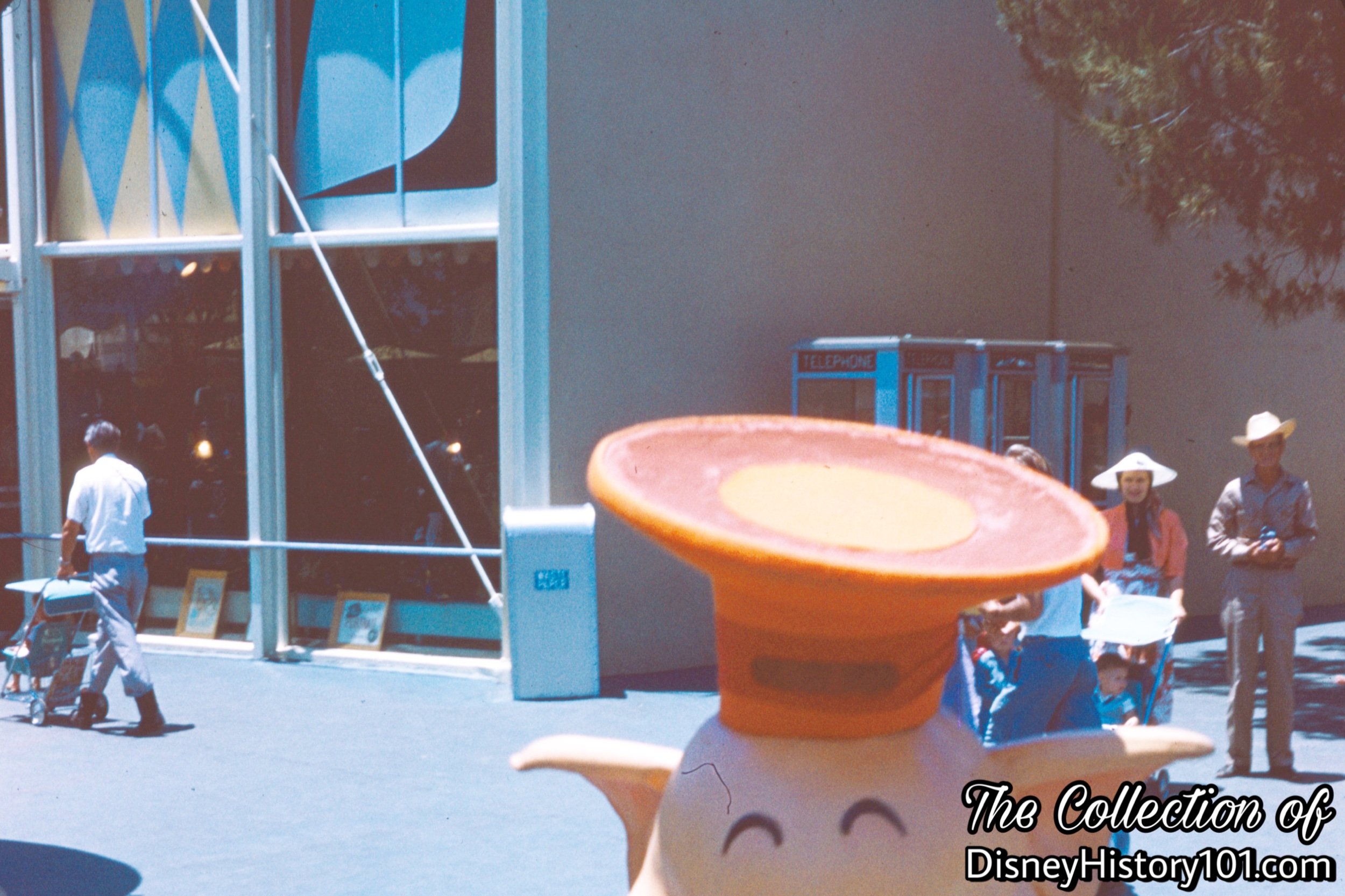 Tomorrowland Exhibit Hall Art Corner Building and Pay Phones.