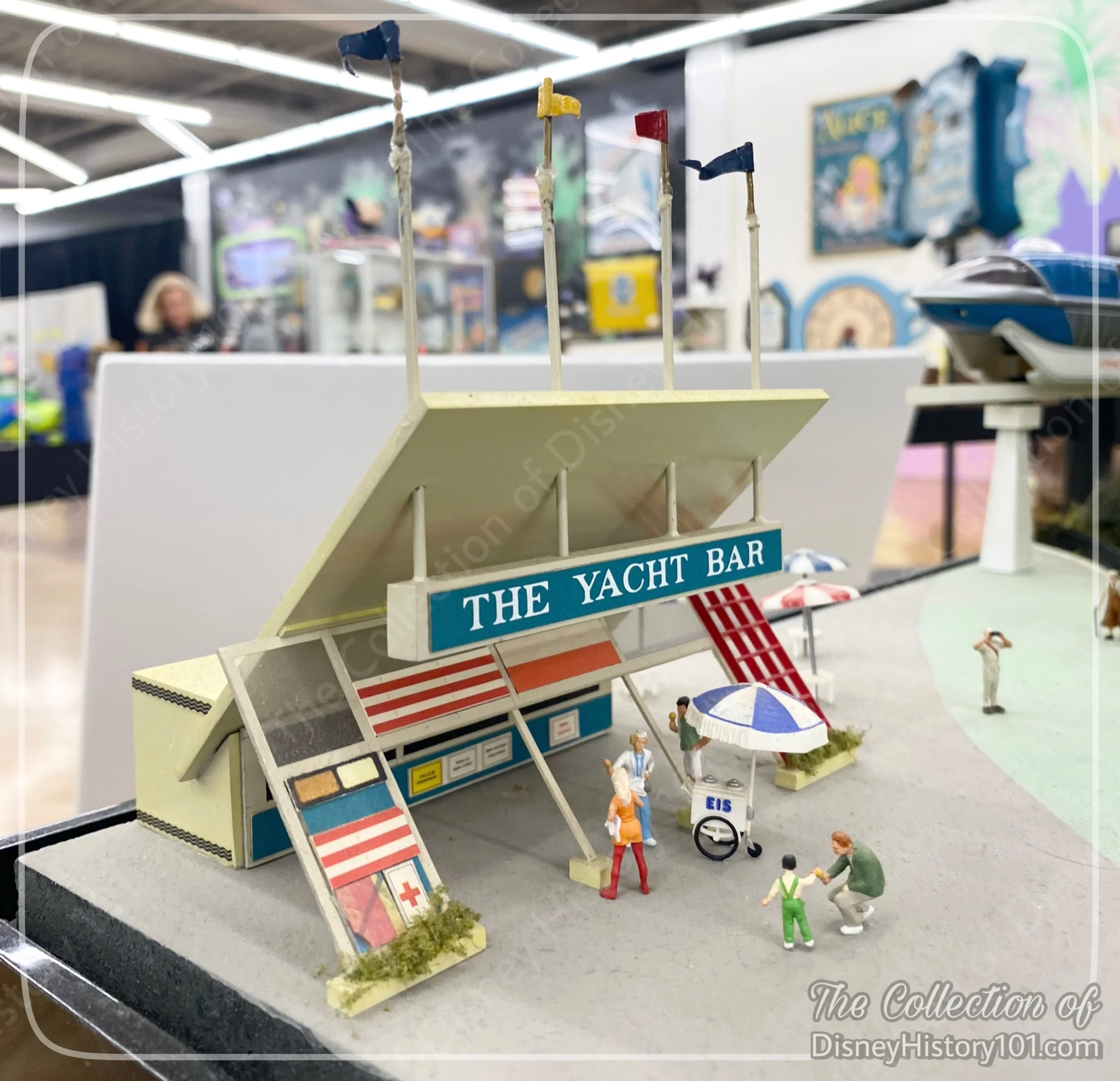 A miniature Yacht Bar was spotted off the port side of a Mighty Matterhorn model at Van Eaton Galleries Presents “The Joel McGee Disneyland Collection” Exhibit.