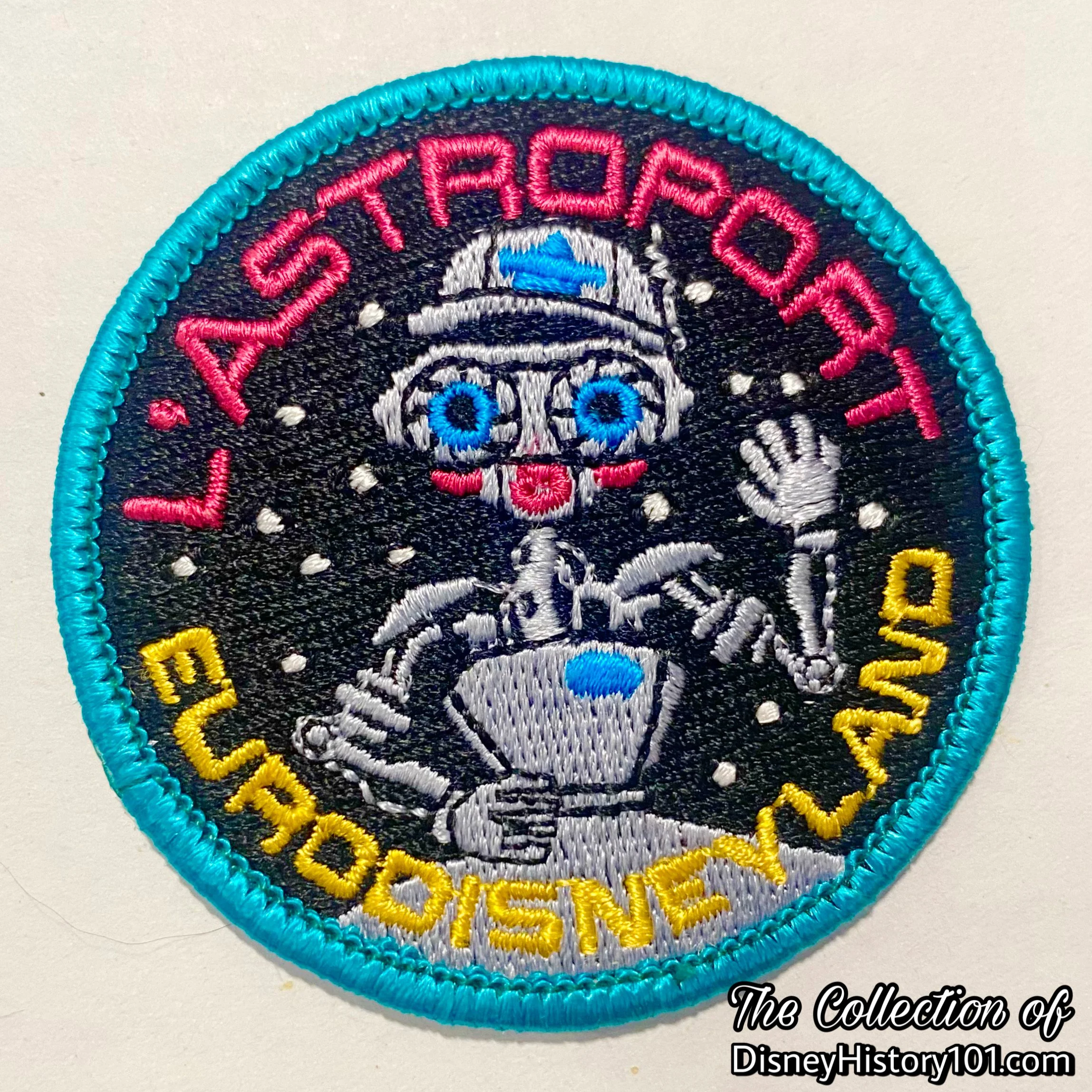 A droid looking much like RX-24 is featured on an embroidered patch promoting L' Astroport at EuroDisneyland. 