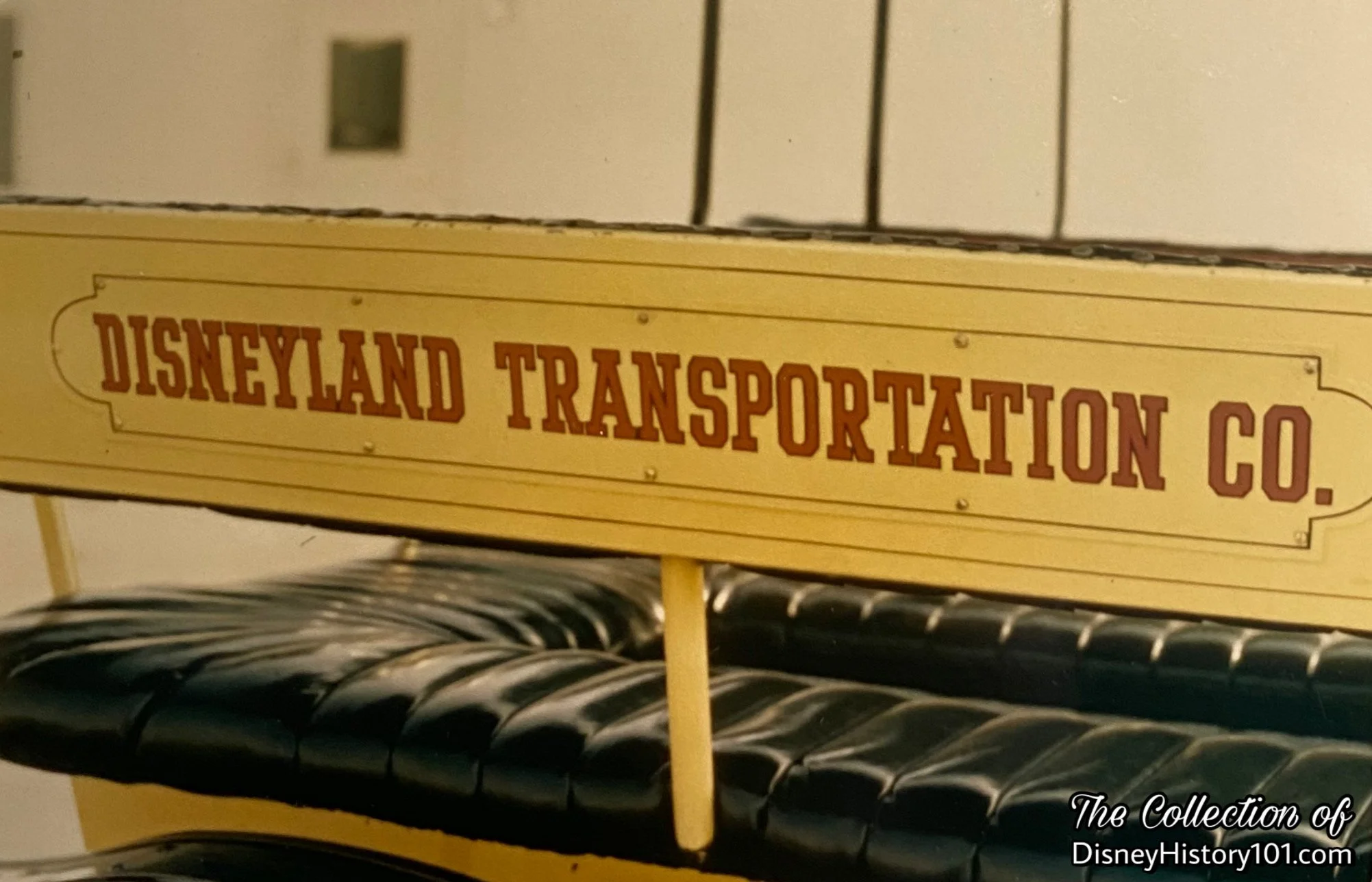 Disneyland Documentational Image focusing on the “Disneyland Transportation Co.” signage on the Horseless Carriage.