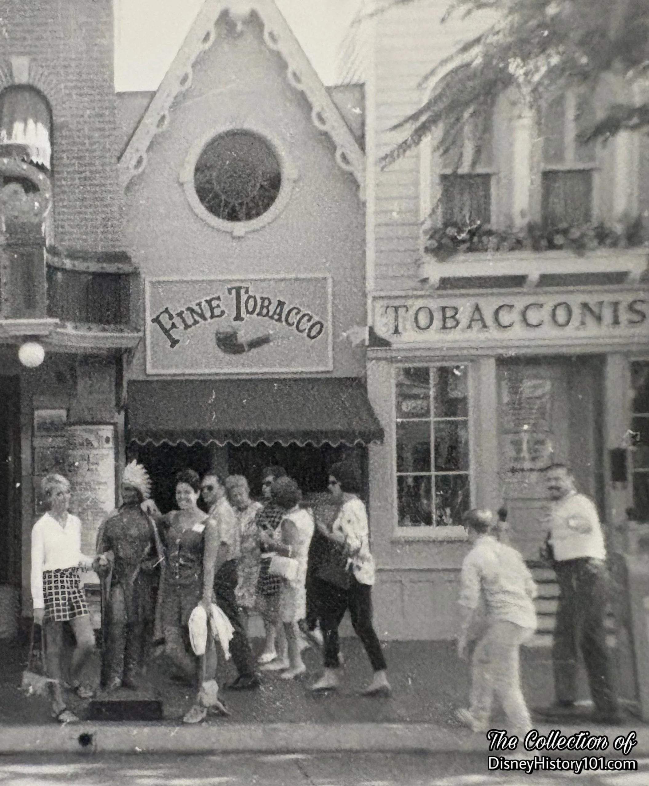 Two Guests take a photo with the Disneyland Tobacco Shop Indian; 1960s.