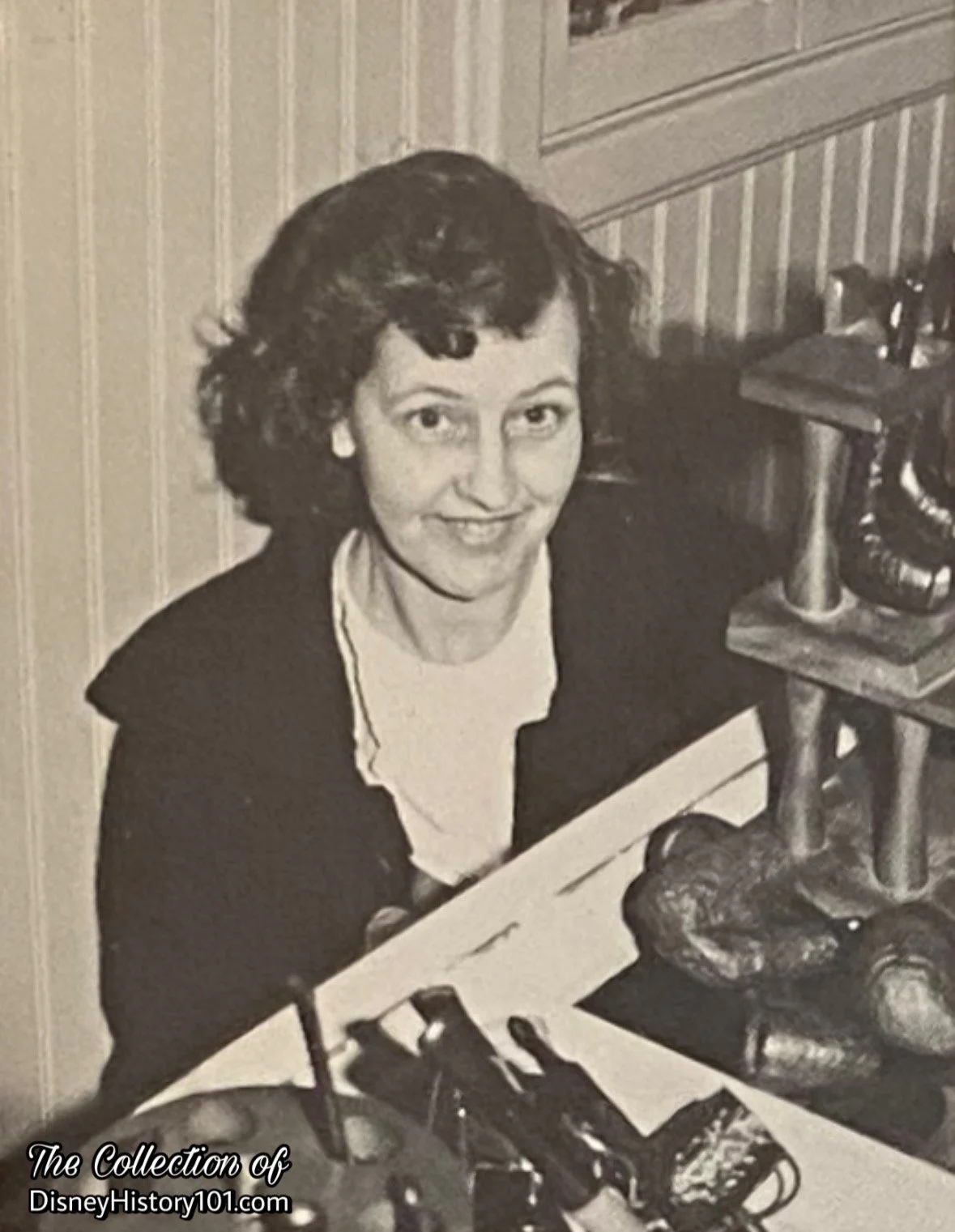 Disneyland Tobacco Shop Hostess Doreen Goodman and some of the pipes in stock, Spring 1966.