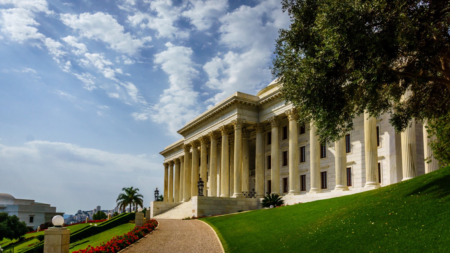 Two members of the Universal House of Justice will retire
